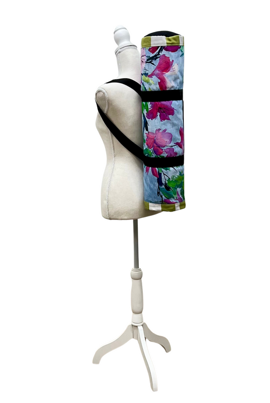 Floral-patterned yoga mat bag on a mannequin with a white background