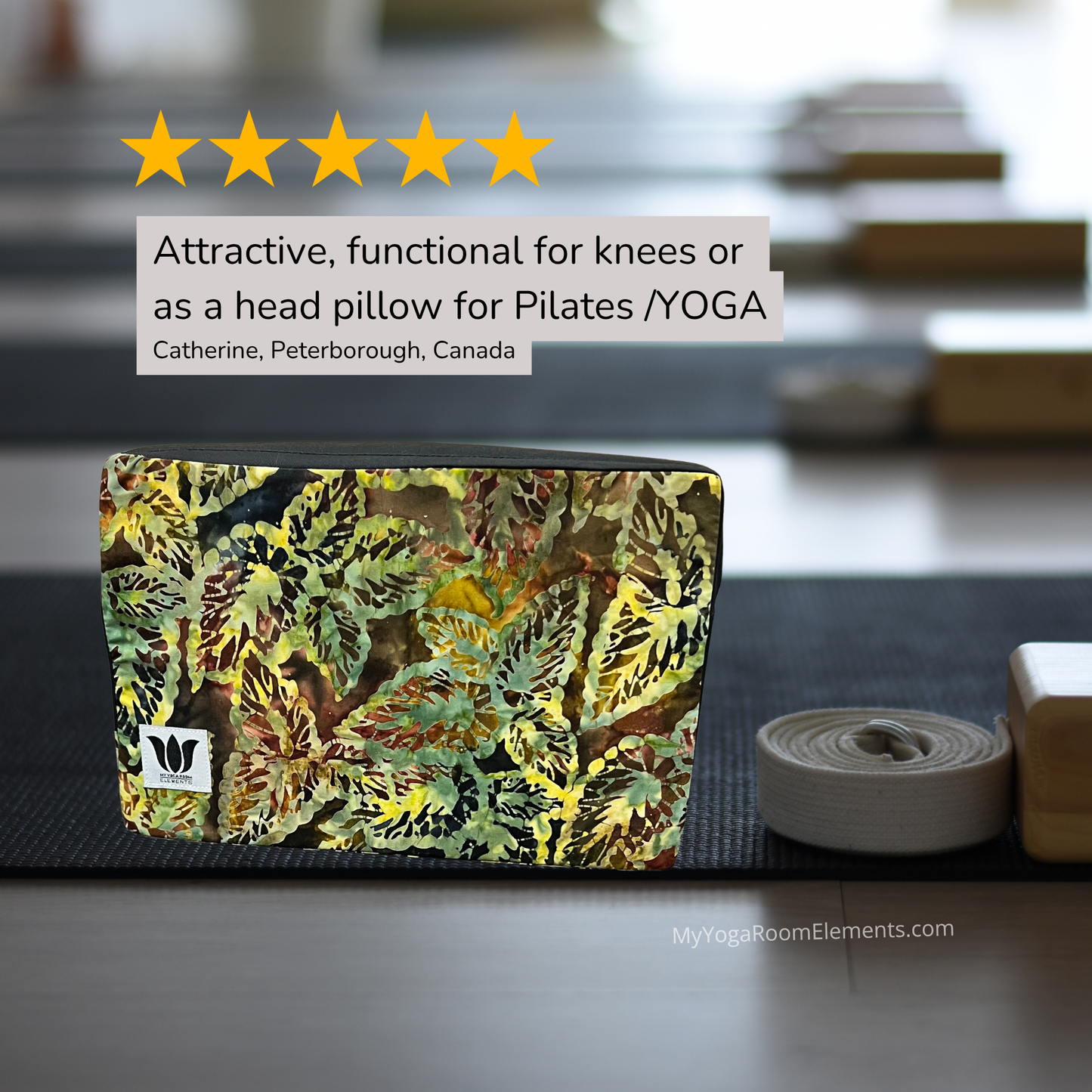 Yoga mat with leaf pattern yoga block on a yoga mat rack, with text about its use for knees or as a head pillow.