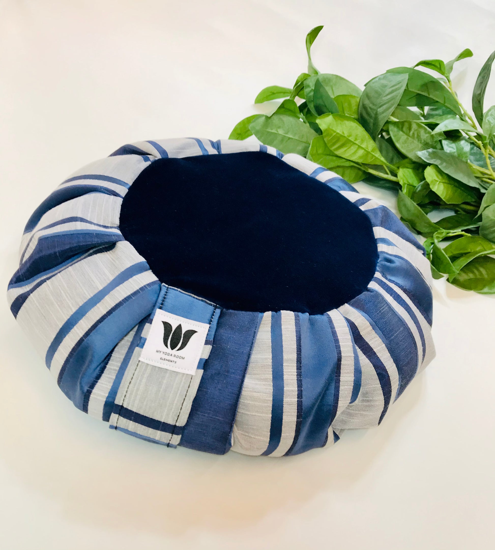 Handcrafted premium satin and linen textured meditation seat cushion in navy blue and and light grey strip with plush dark blue center in solid print. Align the spine and body in comfort to calm the monkey mind in your meditation practice. Handcrafted in Calgary, Alberta Canada