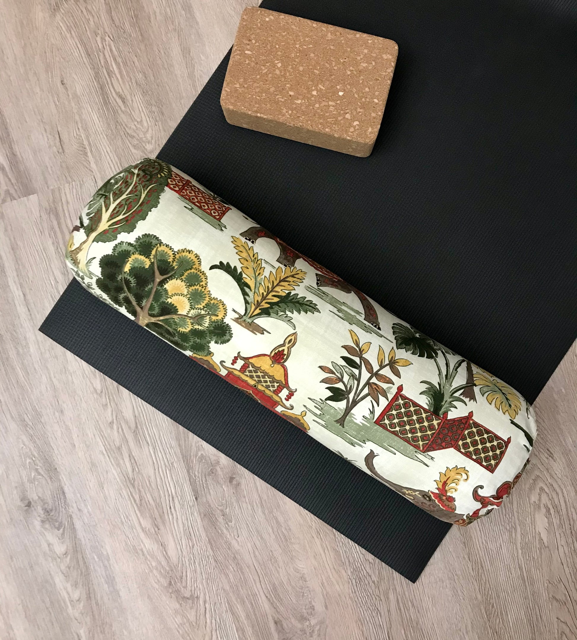 Round yoga bolster in cotton canvas, novelty fabric with India images fabric. Allergy conscious fill with removeable cover. Made in Canada by My Yoga Room Elements