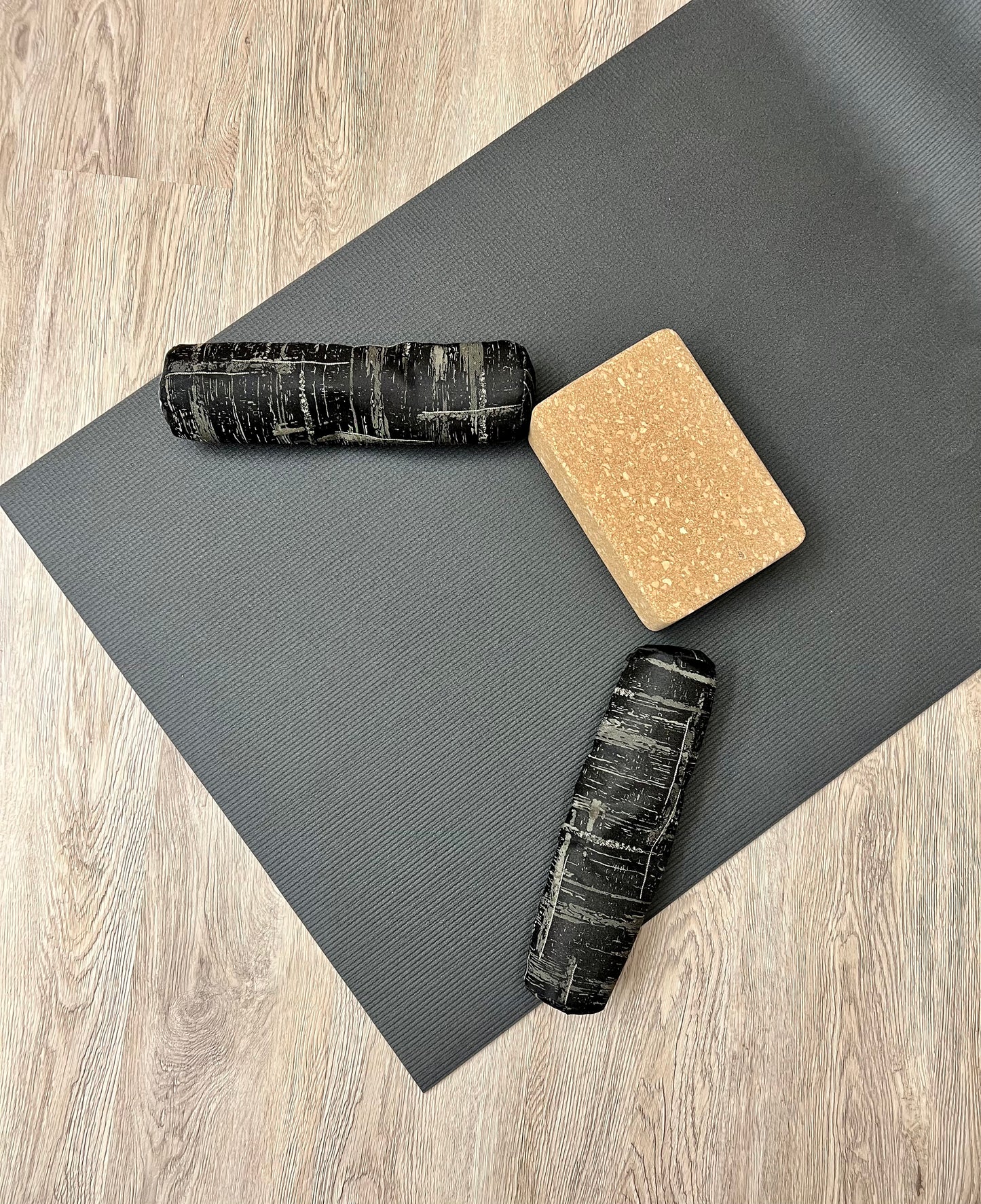 Mini yoga bolster in durable fabric, black and beige hatch print fabric. Cushion and support the body in the practice of yoga and meditation.Removeable cover. Made in Canada by My Yoga Room Elements