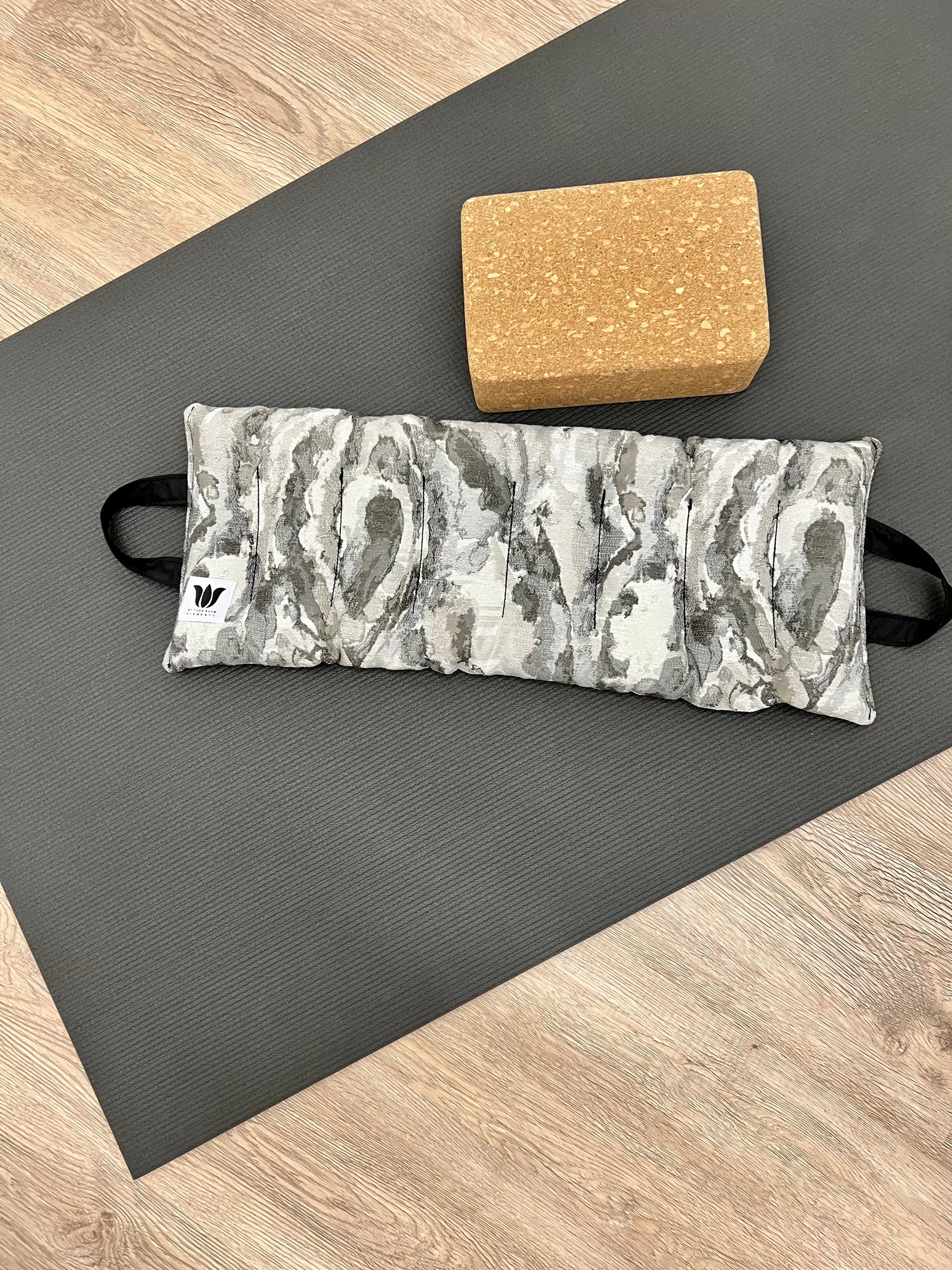 Yoga Sandbag version by My Yoga Room Elements. Add grounding to your practice with this heatable yoga prop. Handcrafted in Calgary in grey marble print fabric.