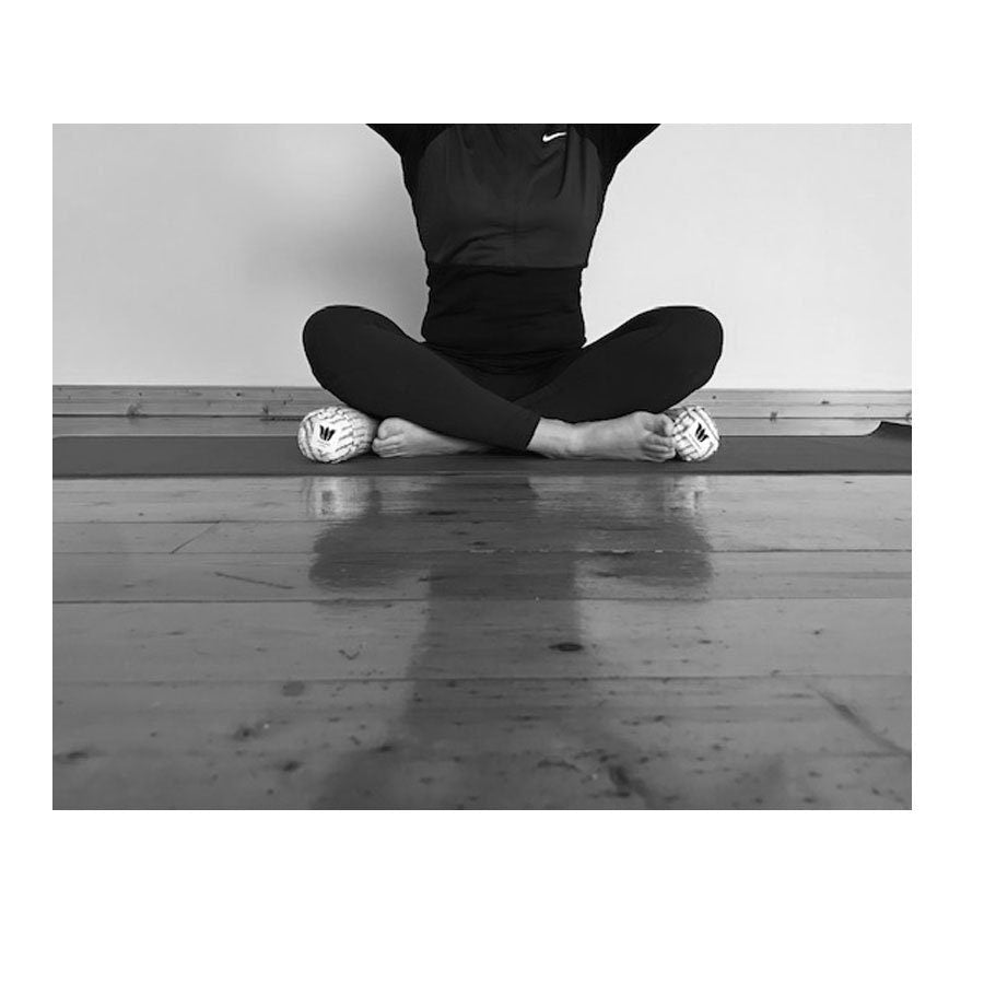 Mini bolsters tucked under thighs to support seated poses. Mini Bolsters by My Yoga Room Elements