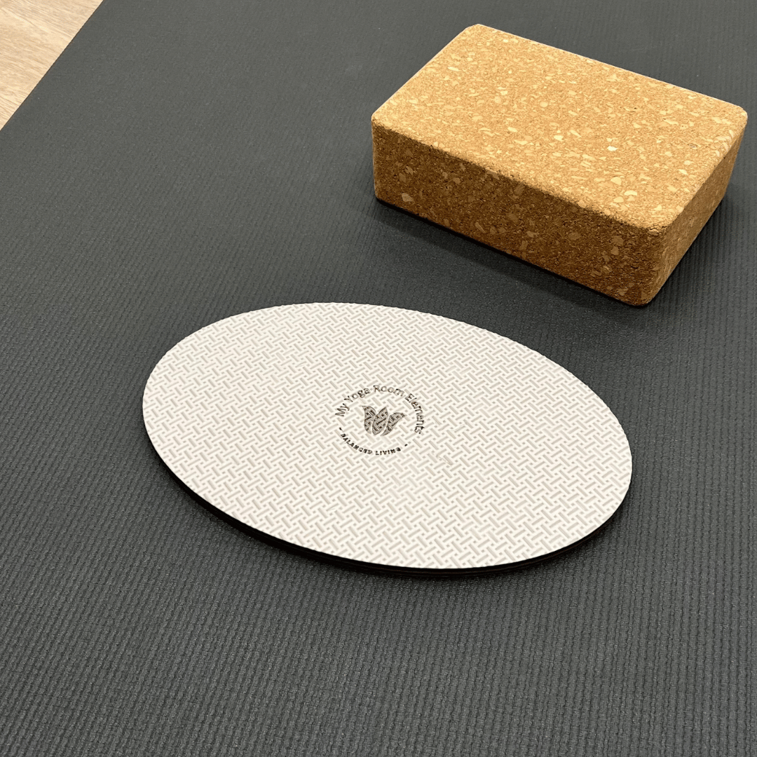 Oval workout / yoga pad, to cushion the body , textured surface, grey in colour