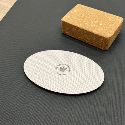Oval workout / yoga pad, to cushion the body , textured surface, grey in colour