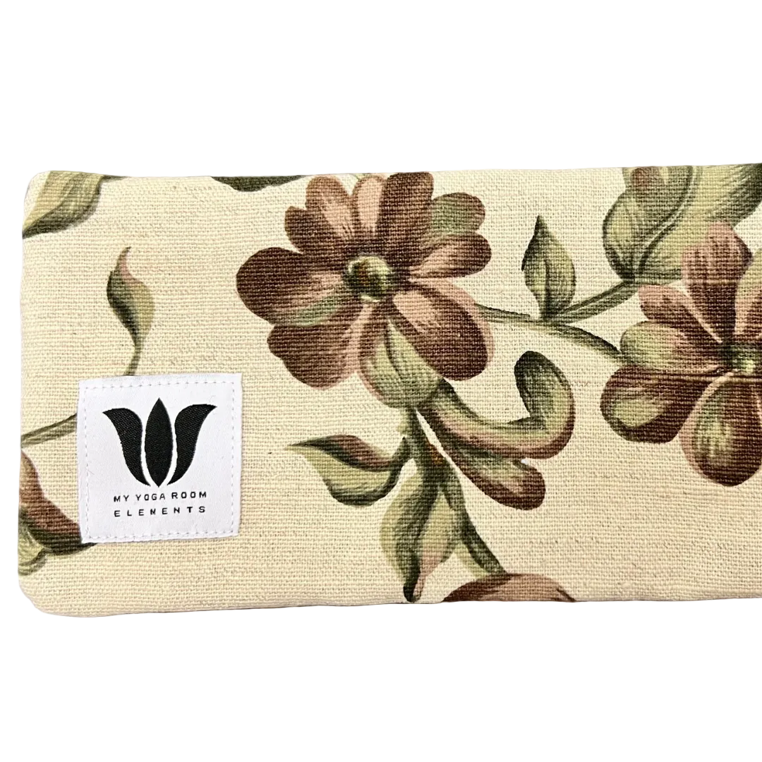 Floral-patterned mat with 'My Yoga Room Elements' label on a textured surface