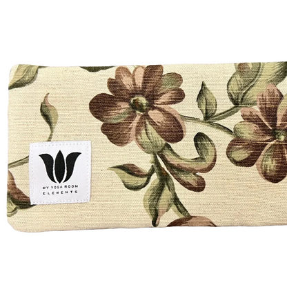 Floral-patterned mat with 'My Yoga Room Elements' label on a textured surface