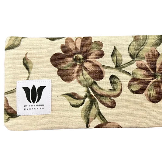 Floral-patterned mat with 'My Yoga Room Elements' label on a textured surface
