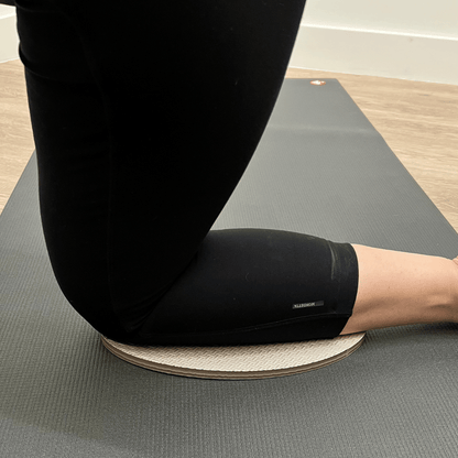 Oval workout / yoga pad, to cushion the body , textured surface, grey in colour