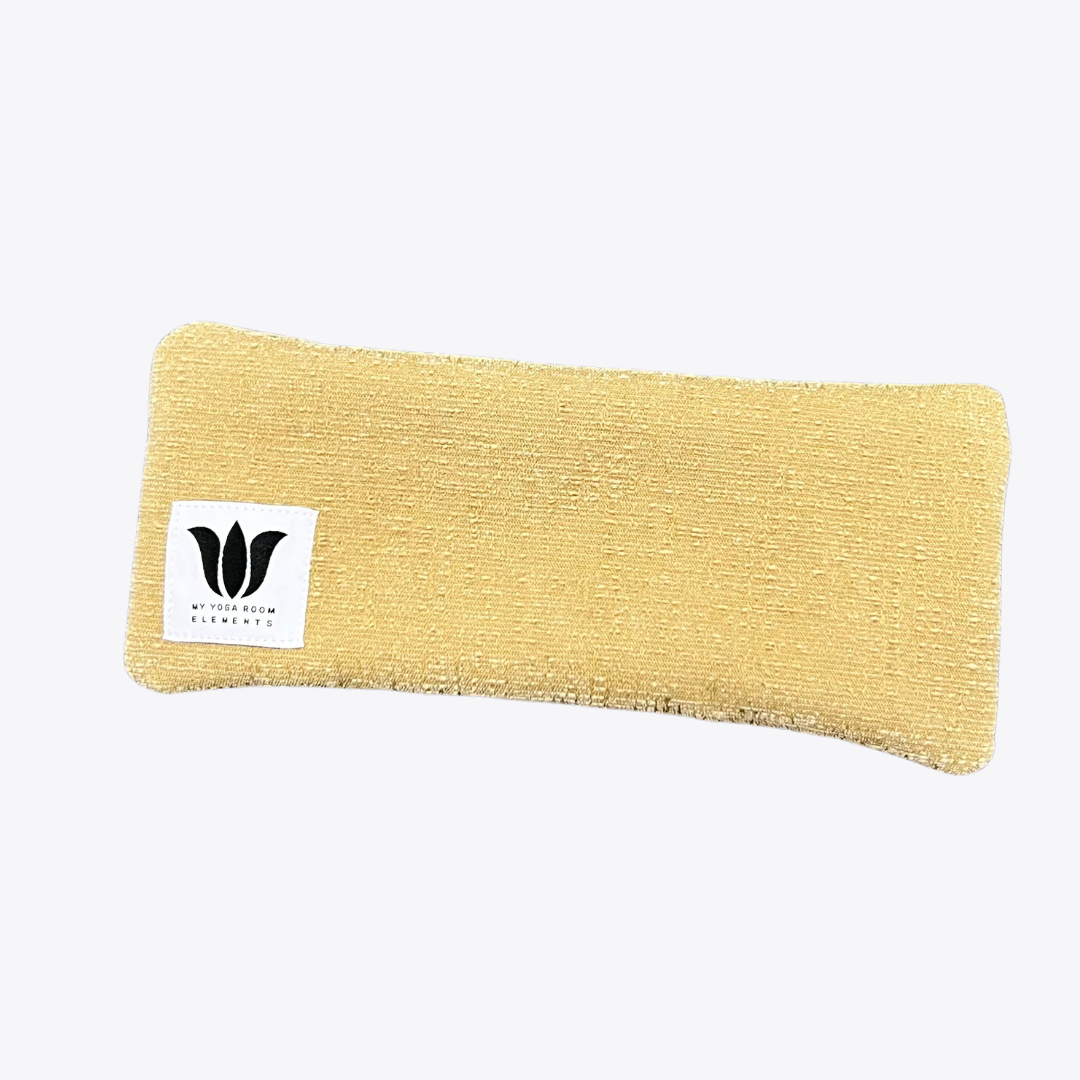 camel brown eye pillow plush texture with white and black lotus logo