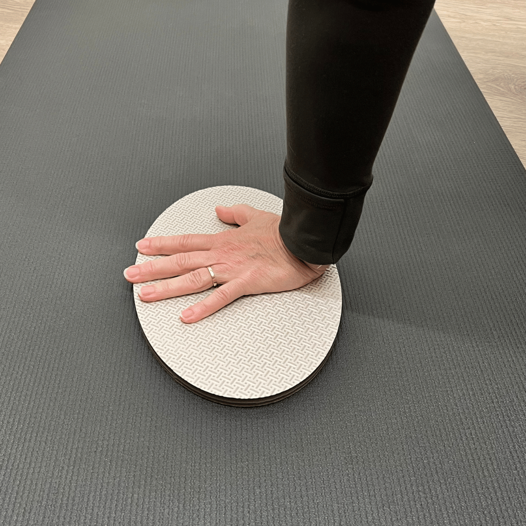 Oval workout / yoga pad, to cushion the body , textured surface, grey in colour