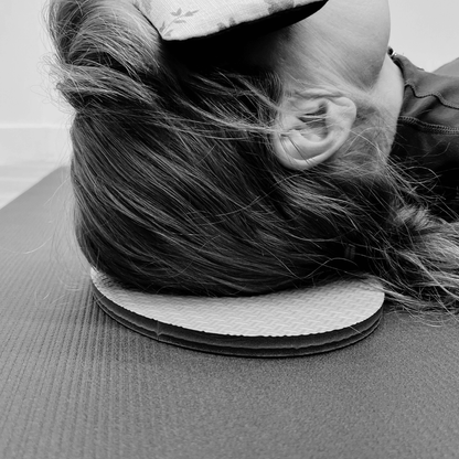 Oval workout / yoga pad, to cushion the body , textured surface, grey in colour