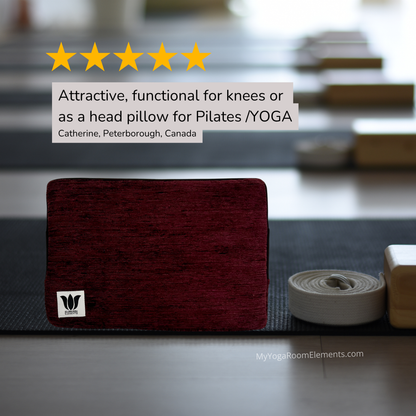 purple yoga block with a visible brand logo on a yoga mat rack, with text overlay about its use.