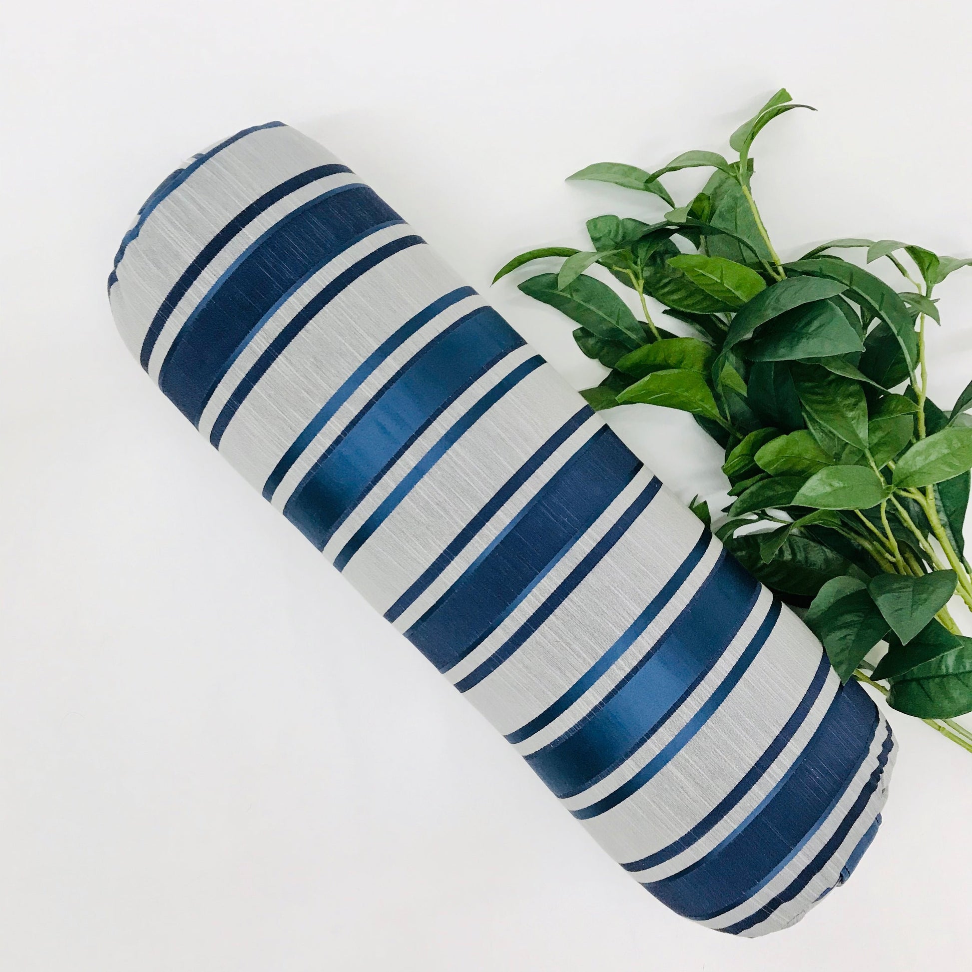 Round yoga bolster in blue and grey strip print fabric. Allergy conscious fill with removeable cover. Made in Canada by My Yoga Room Elements