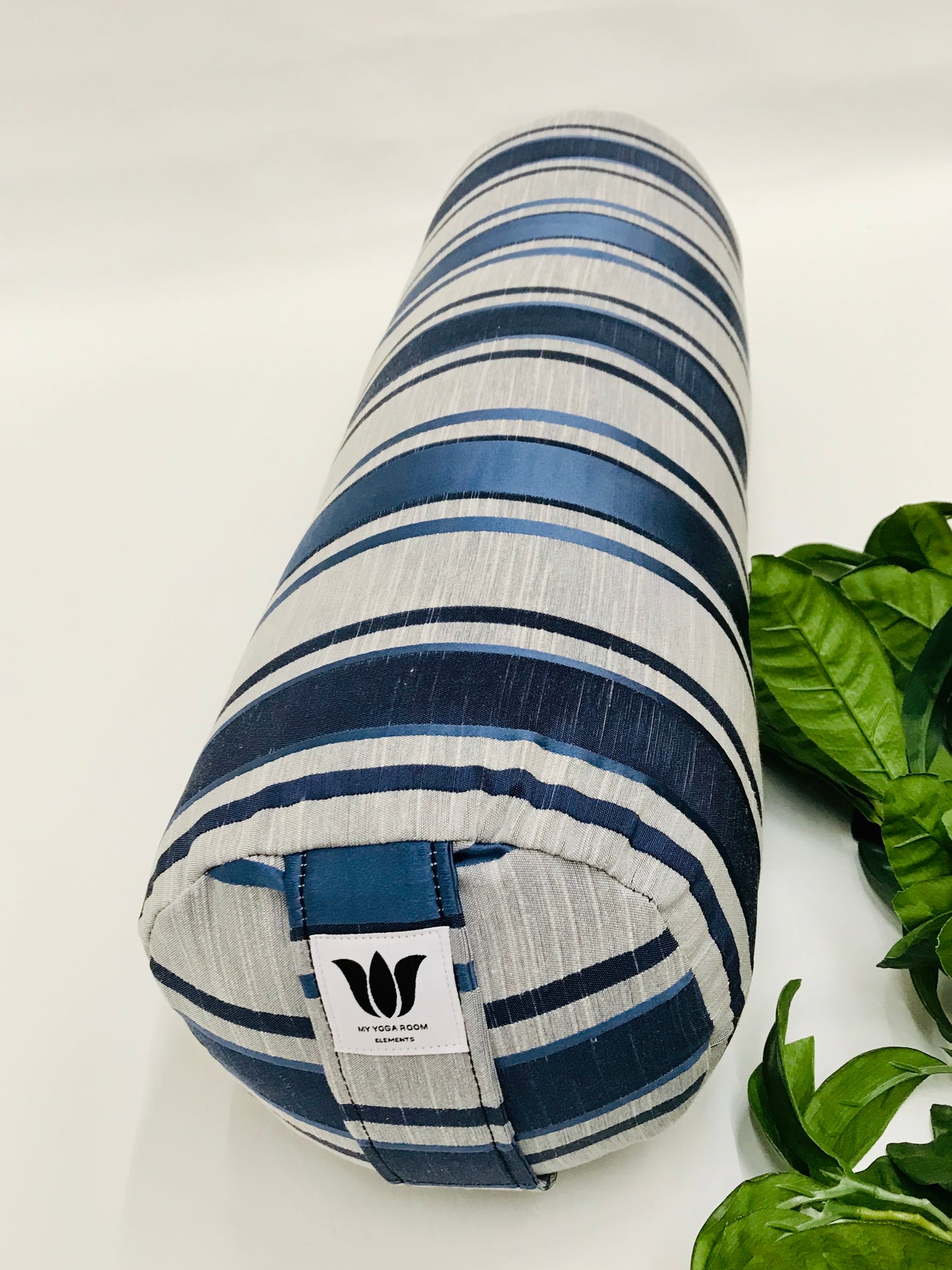 Round yoga bolster in blue and grey strip print fabric. Allergy conscious fill with removeable cover. Made in Canada by My Yoga Room Elements