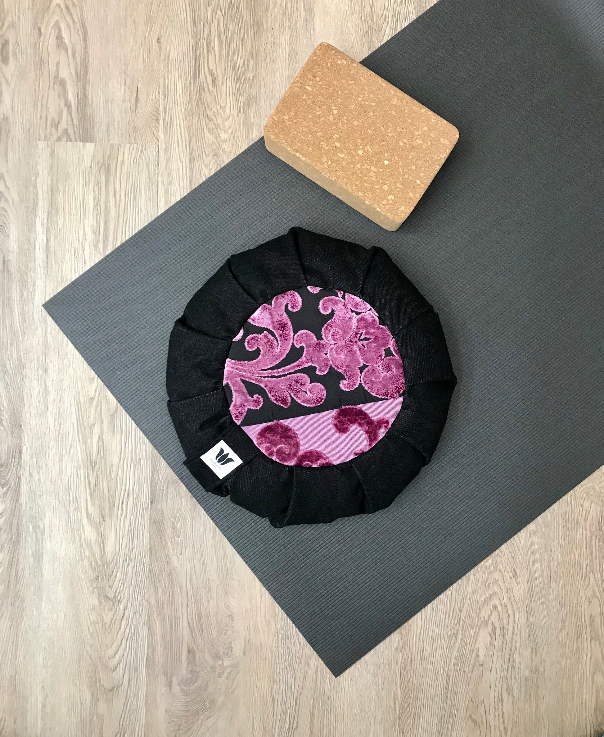 Handcrafted premium black denim and purple plush fabric meditation seat cushion. Align the spine and body in comfort to calm the monkey mind in your meditation practice. Handcrafted in Calgary, Alberta Canada