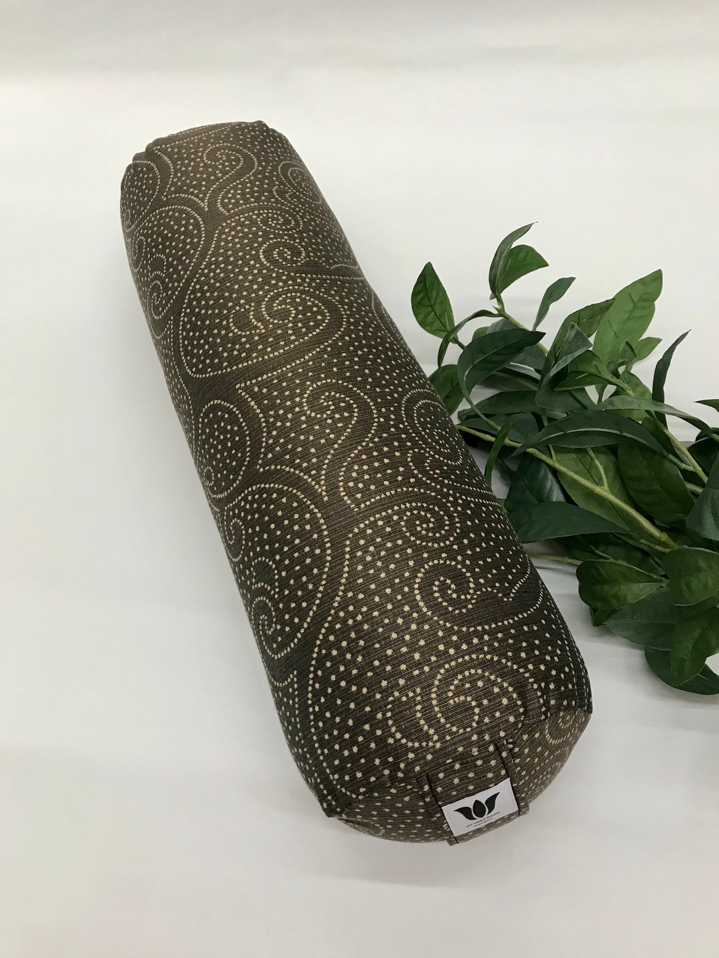 Round yoga bolster in brown durable swirl print fabric . Allergy conscious fill with removeable cover. Made in Canada by My Yoga Room Elements