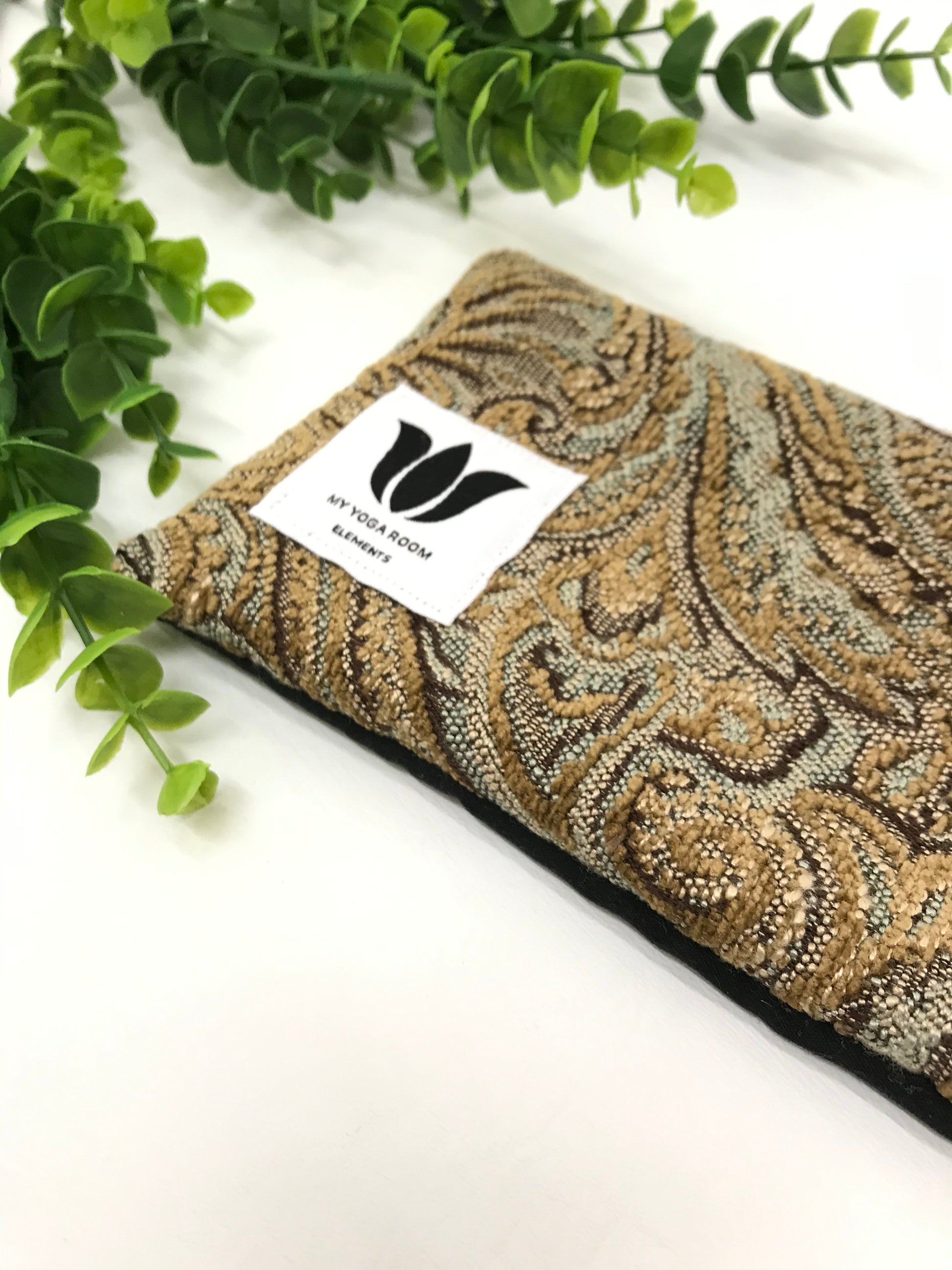 Yoga eye pillow, unscented, therapeutically weighted to soothe eye strain and stress or enhance your savasana. Handcrafted in Canada by My Yoga Room Elements. Brown plush paisley print and bamboo fabric.