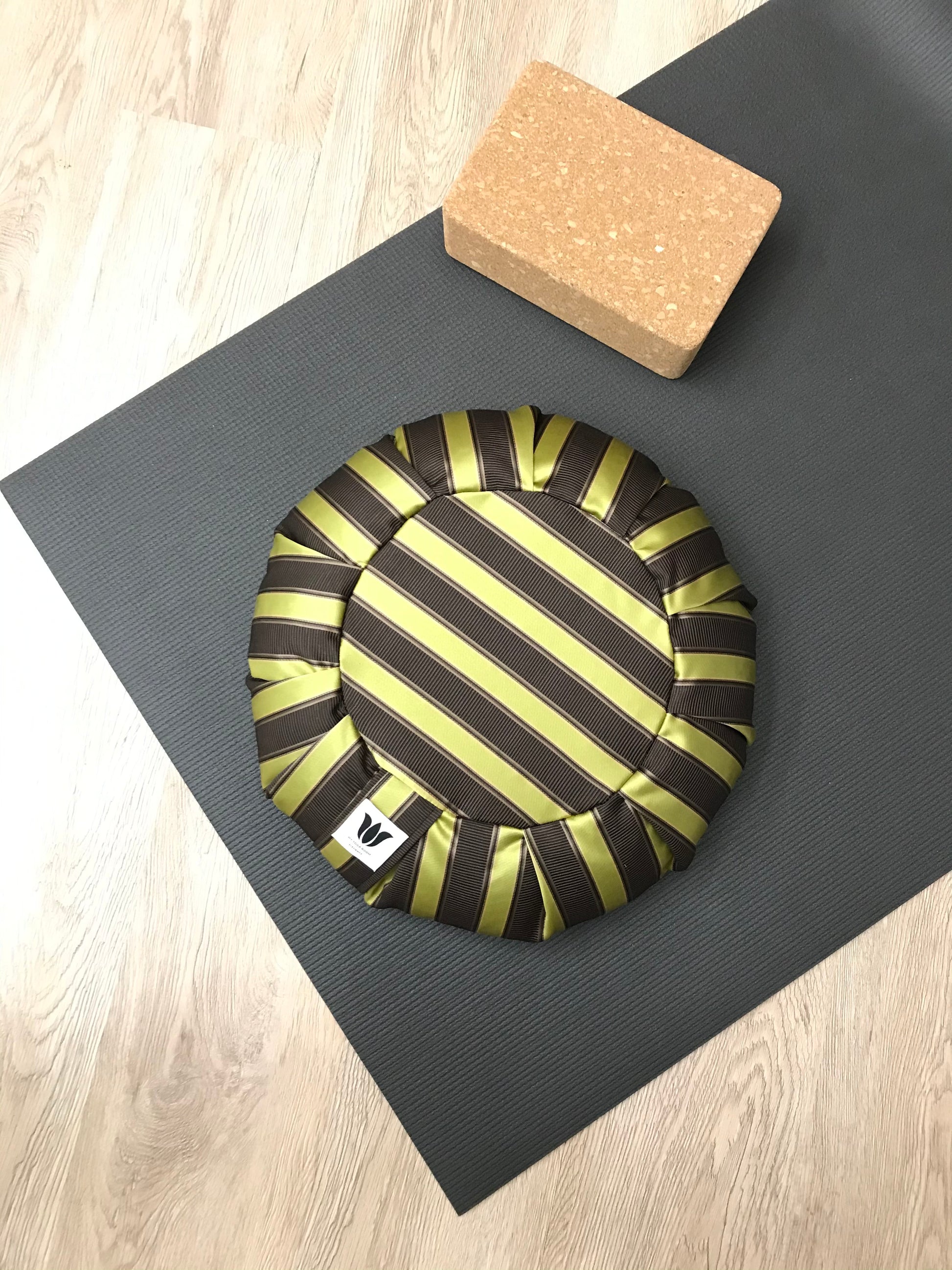 Handcrafted premium sateen home decor fabric meditation seat cushion in purple and gold-green stripe fabric. Align the spine and body in comfort to calm the monkey mind in your meditation practice. Handcrafted in Calgary, Alberta Canada