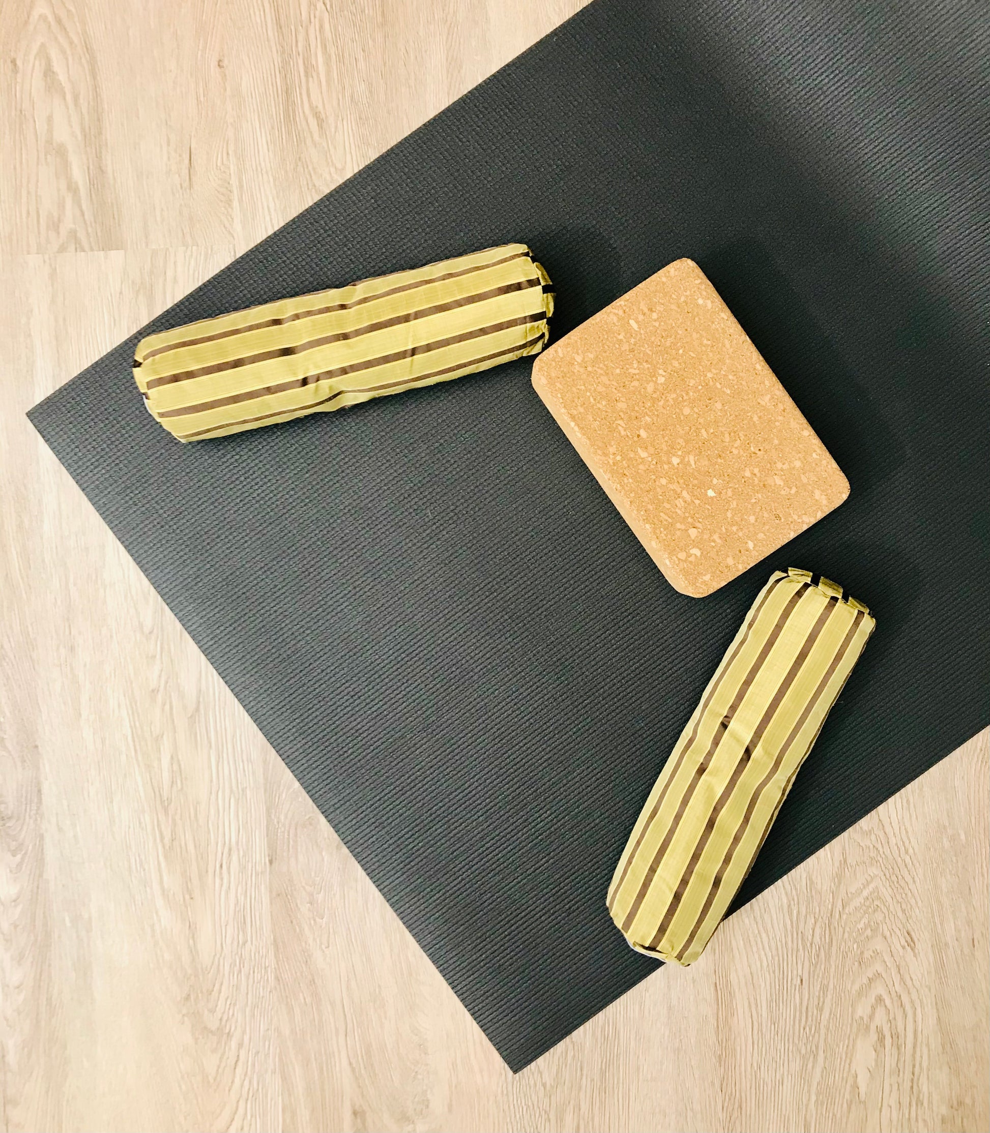 Mini yoga bolster in durable fabric, light brown stripe fabric. Cushion and support the body in the practice of yoga and meditation.Removeable cover. Made in Canada by My Yoga Room Elements