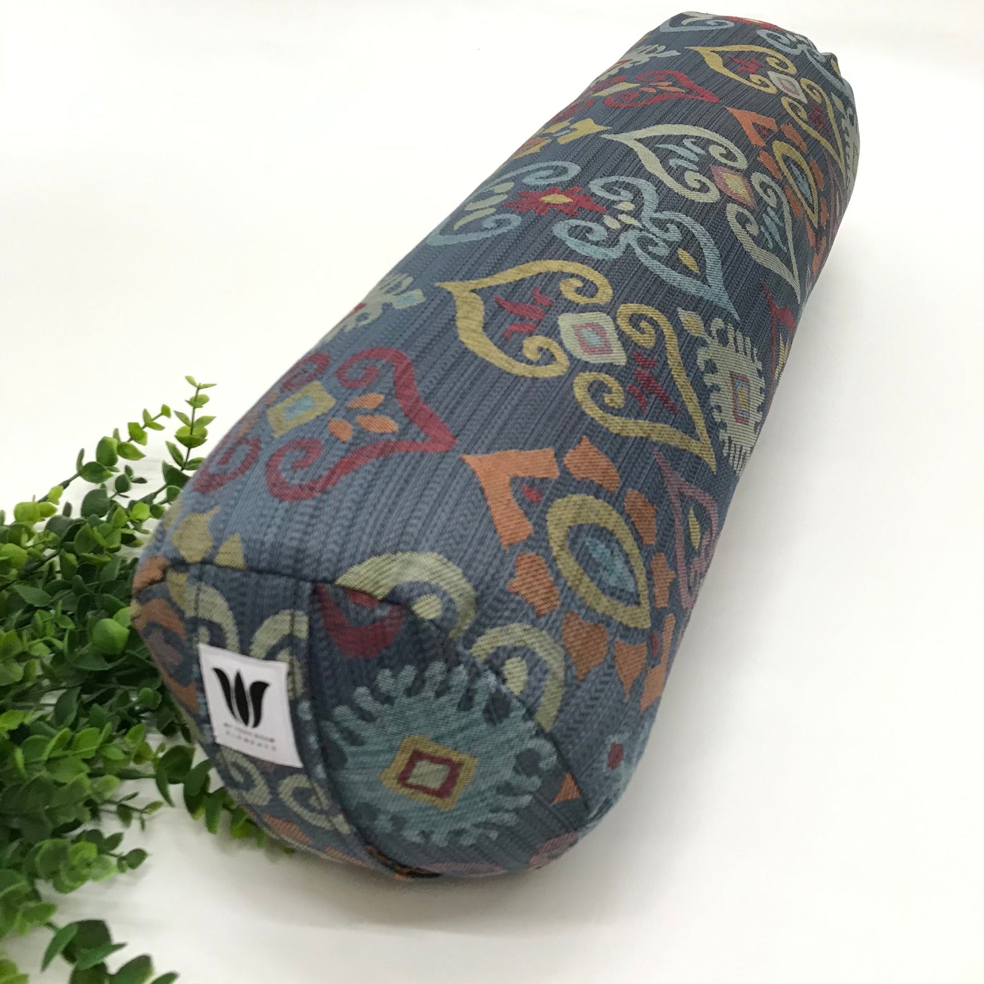 Round yoga bolster in blue and smoky rainbow colour print fabric. Allergy conscious fill with removeable cover. Made in Canada by My Yoga Room Elements