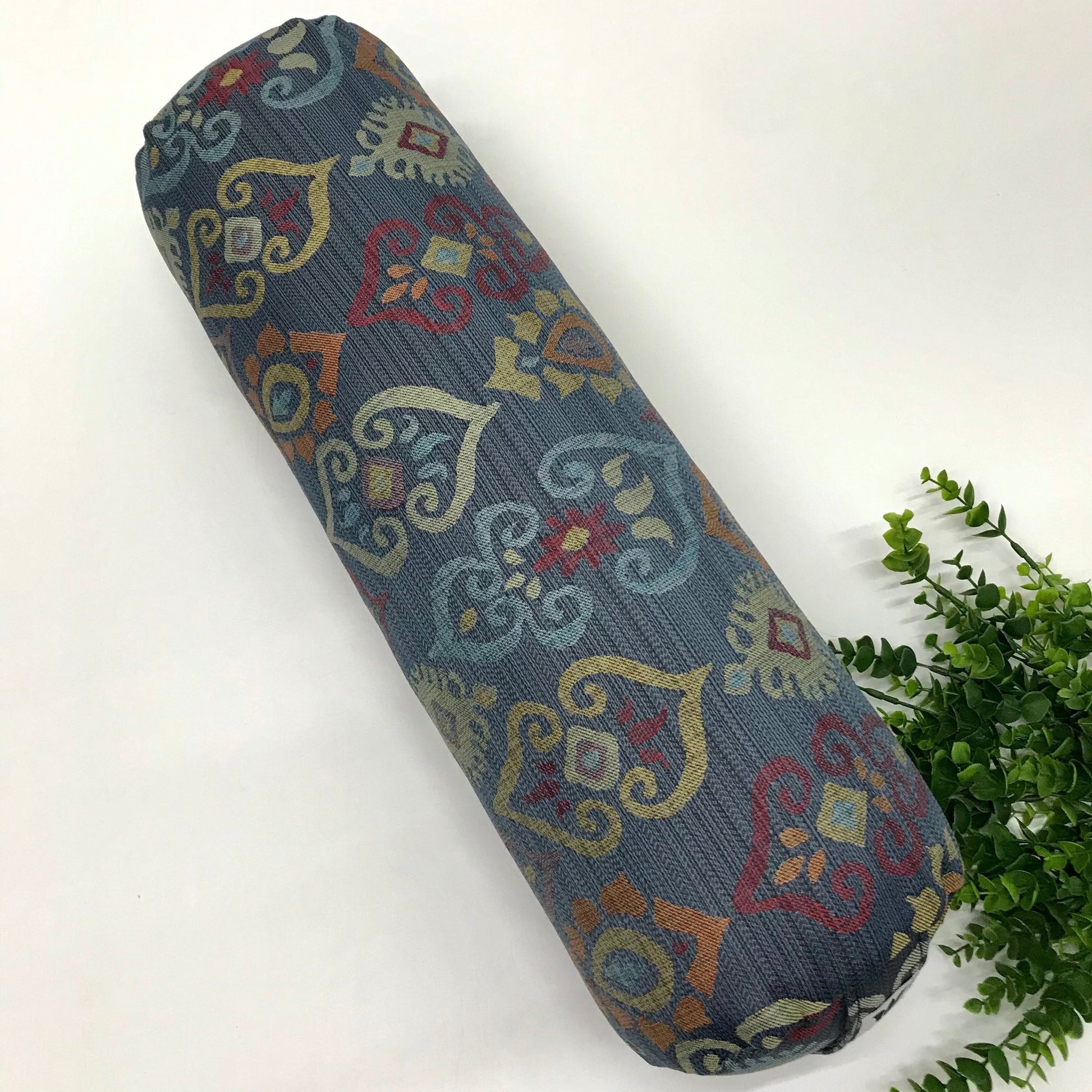 Round yoga bolster in blue and smoky rainbow colour print fabric. Allergy conscious fill with removeable cover. Made in Canada by My Yoga Room Elements