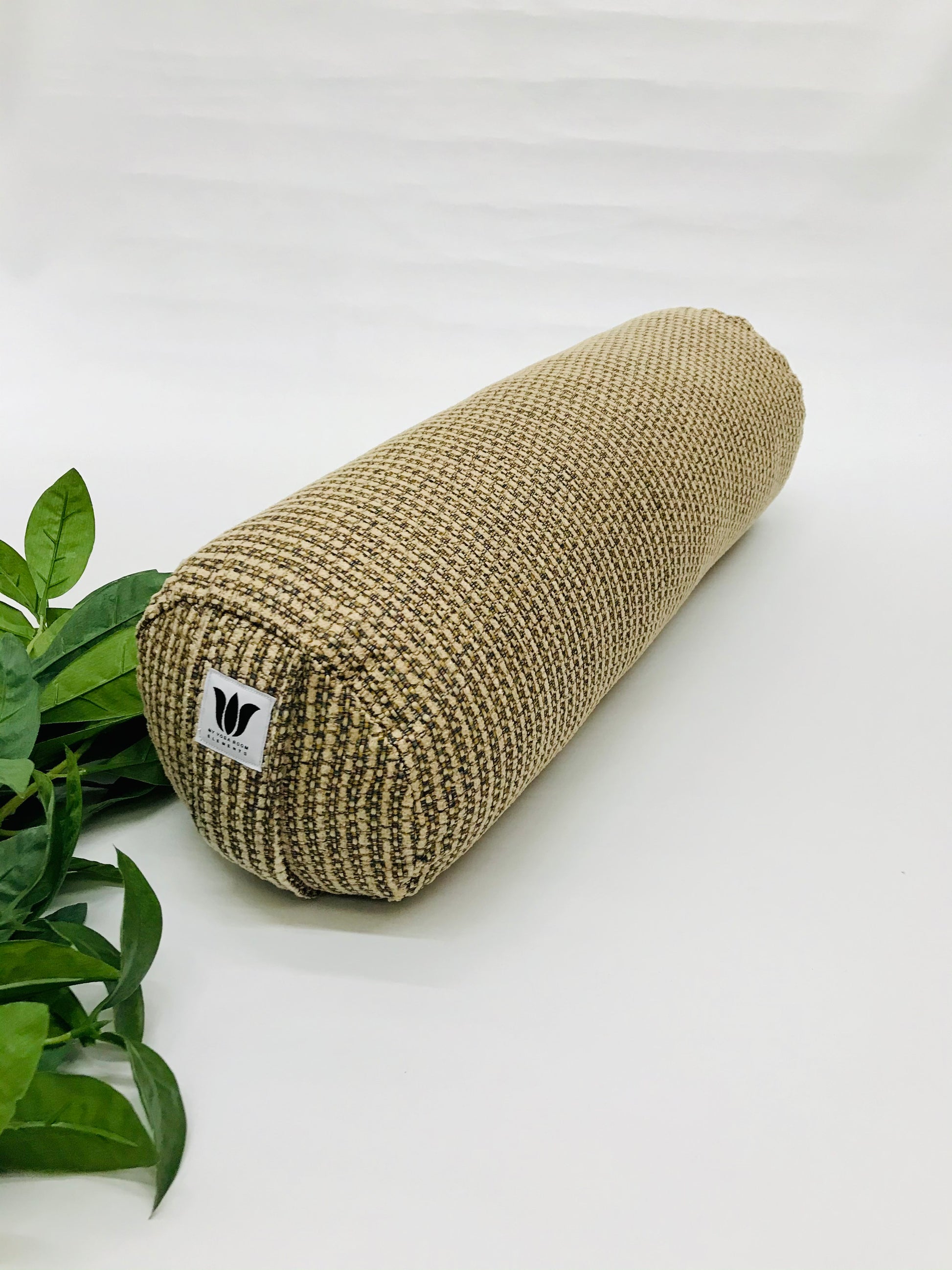 Round yoga bolster in brown durable tweed print fabric . Allergy conscious fill with removeable cover. Made in Canada by My Yoga Room Elements