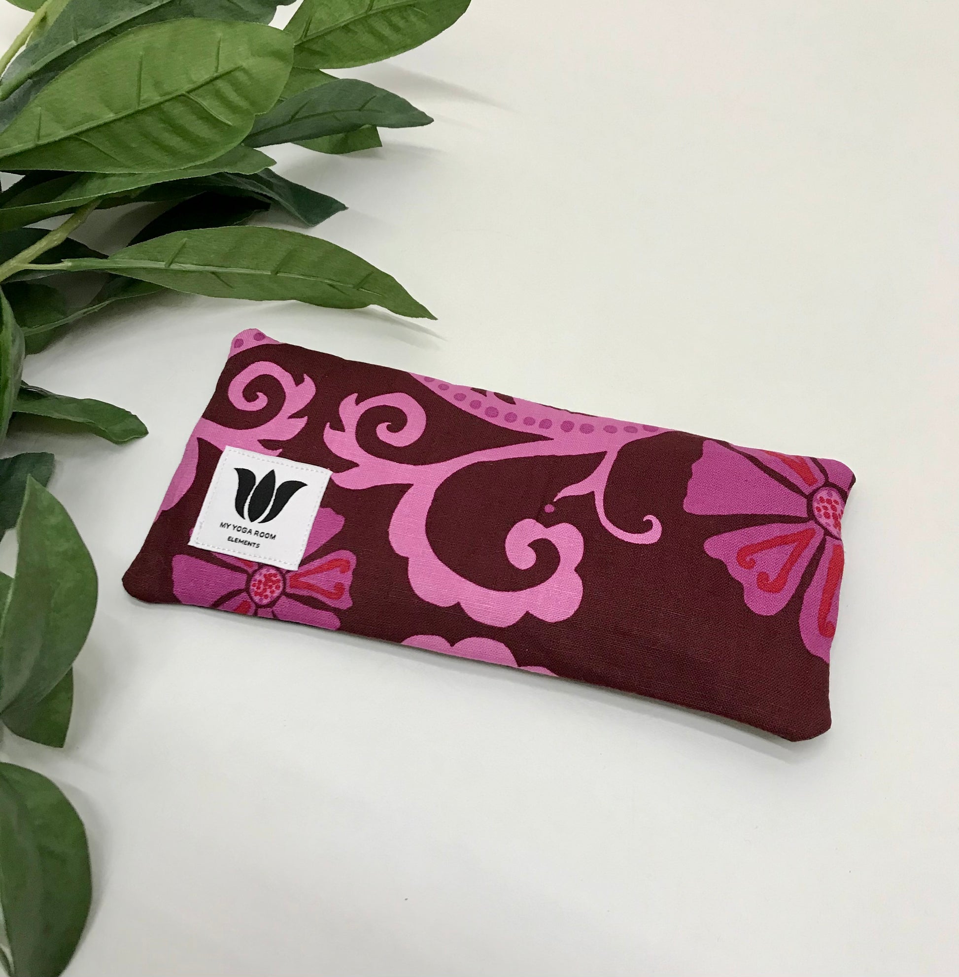 Yoga eye pillow, unscented, therapeutically weighted to soothe eye strain and stress or enhance your savasana. Handcrafted in Canada by My Yoga Room Elements. Pink purple modern floral print and bamboo fabric.