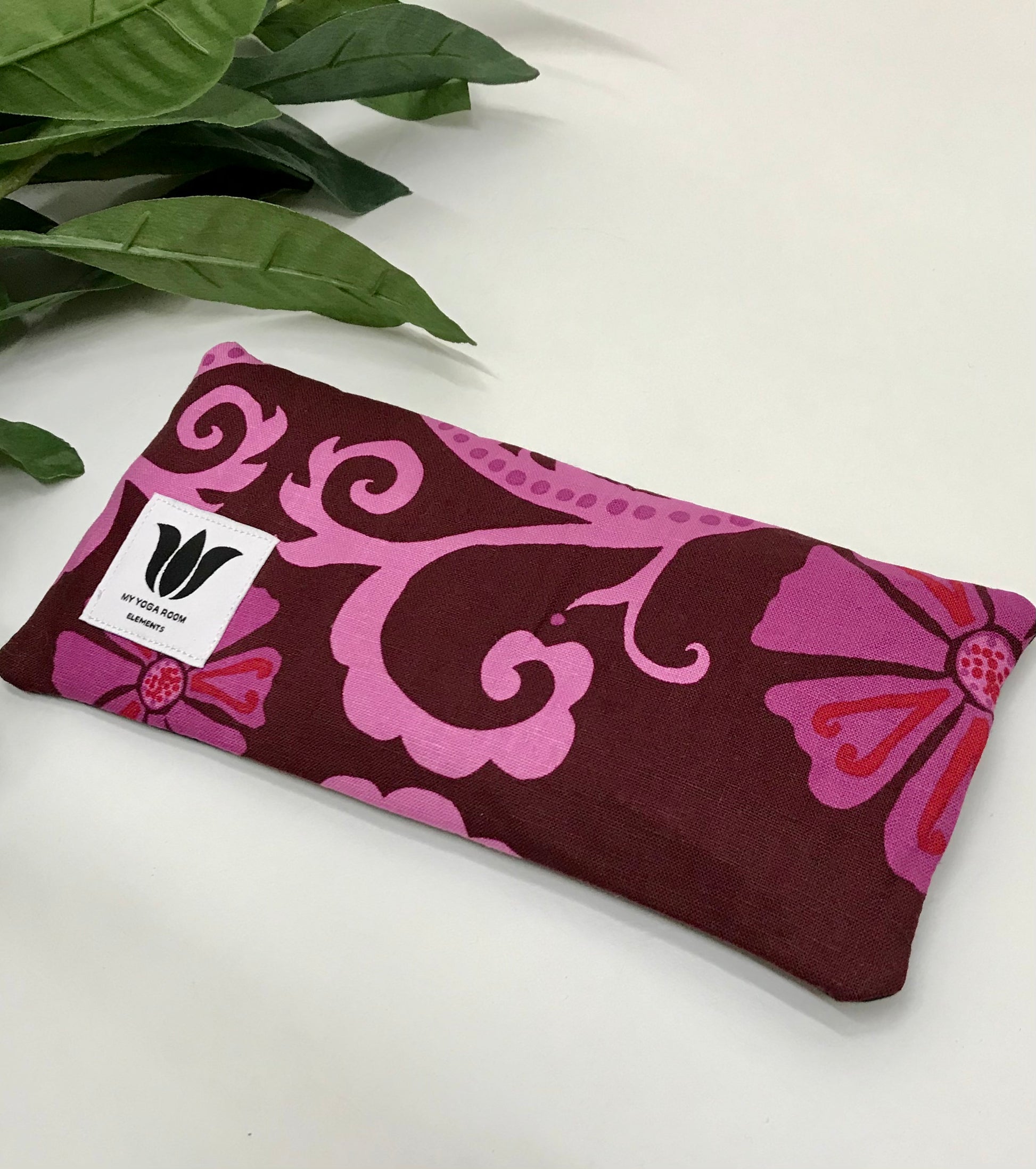 Yoga eye pillow, unscented, therapeutically weighted to soothe eye strain and stress or enhance your savasana. Handcrafted in Canada by My Yoga Room Elements. Pink purple modern floral print and bamboo fabric.