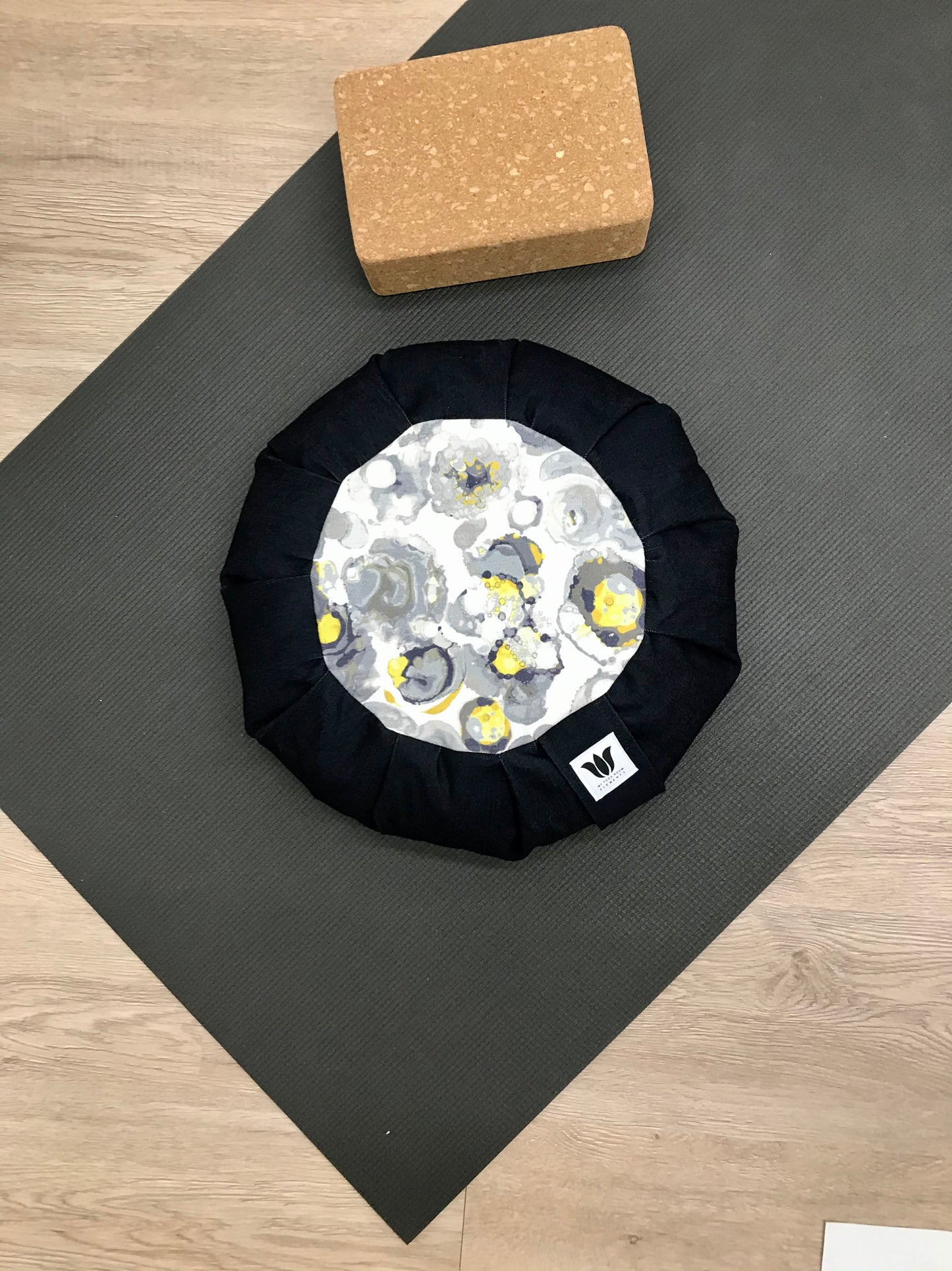 Handcrafted premium cotton denim meditation seat cushion in solid navy blue, grey-blue and yellow watercolor print center. Align the spine and body in comfort to calm the monkey mind in your meditation practice. Handcrafted in Calgary, Alberta Canada