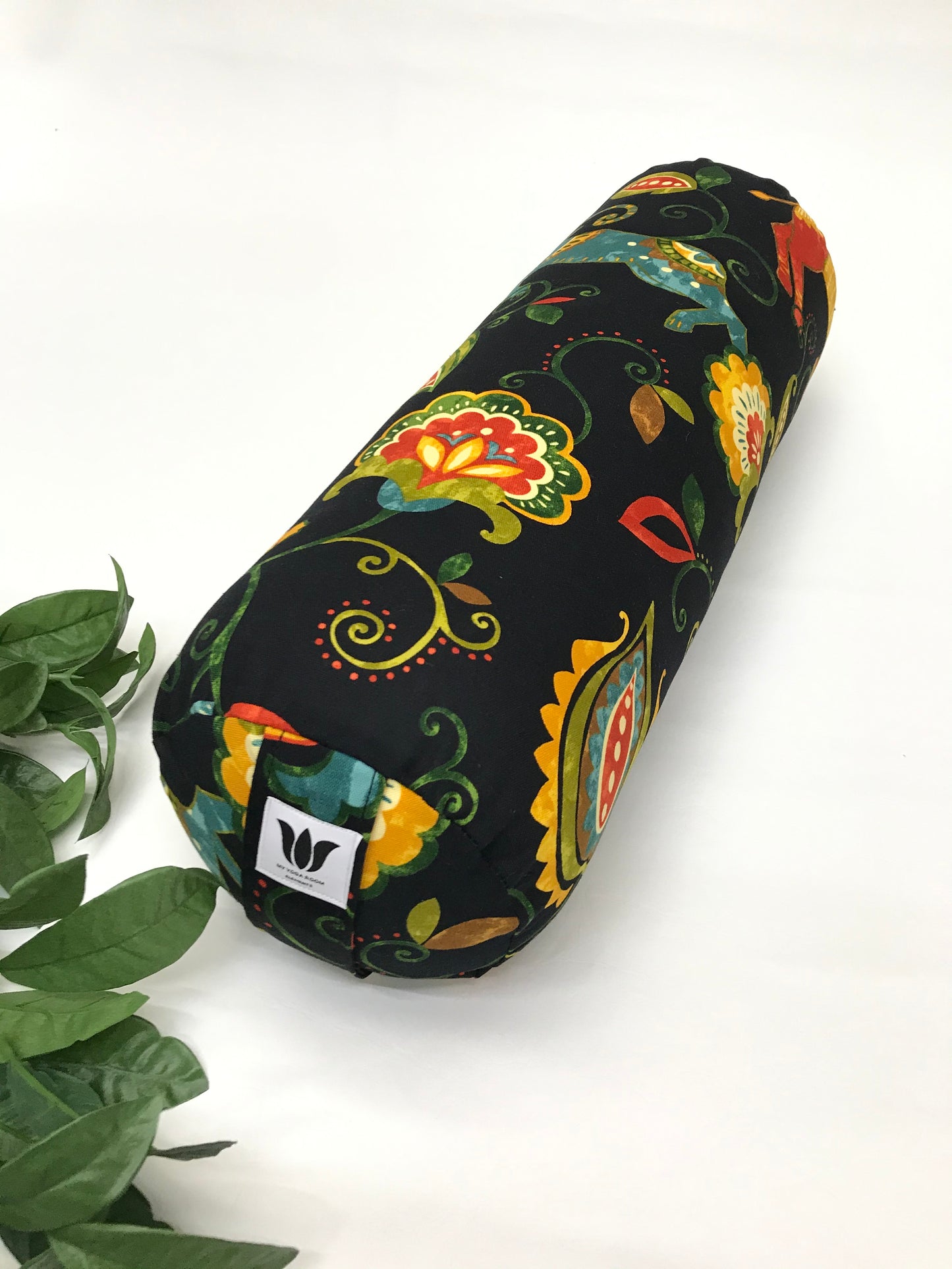 Round yoga bolster in durable cotton canvas, in black and bright colour novelty print fabric. Allergy conscious fill with removeable cover. Made in Canada by My Yoga Room Elements