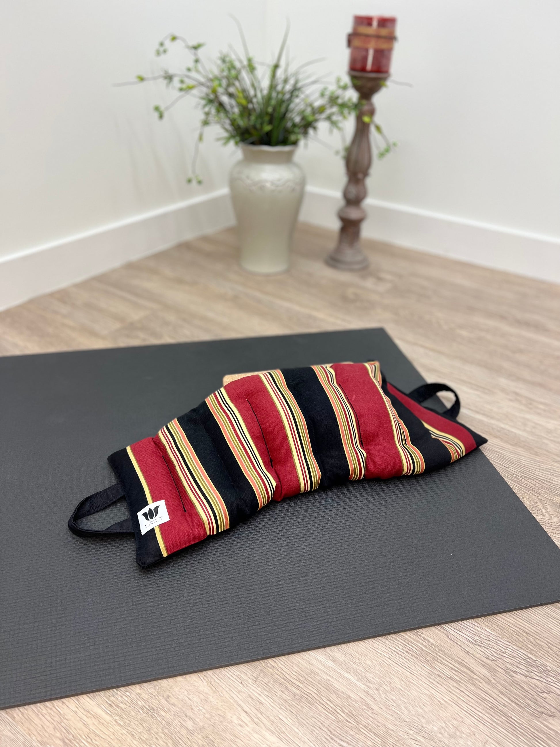 Yoga Sandbag version by My Yoga Room Elements. Add grounding to your practice with this heatable yoga prop. Handcrafted in Calgary in canvas striped fabric.