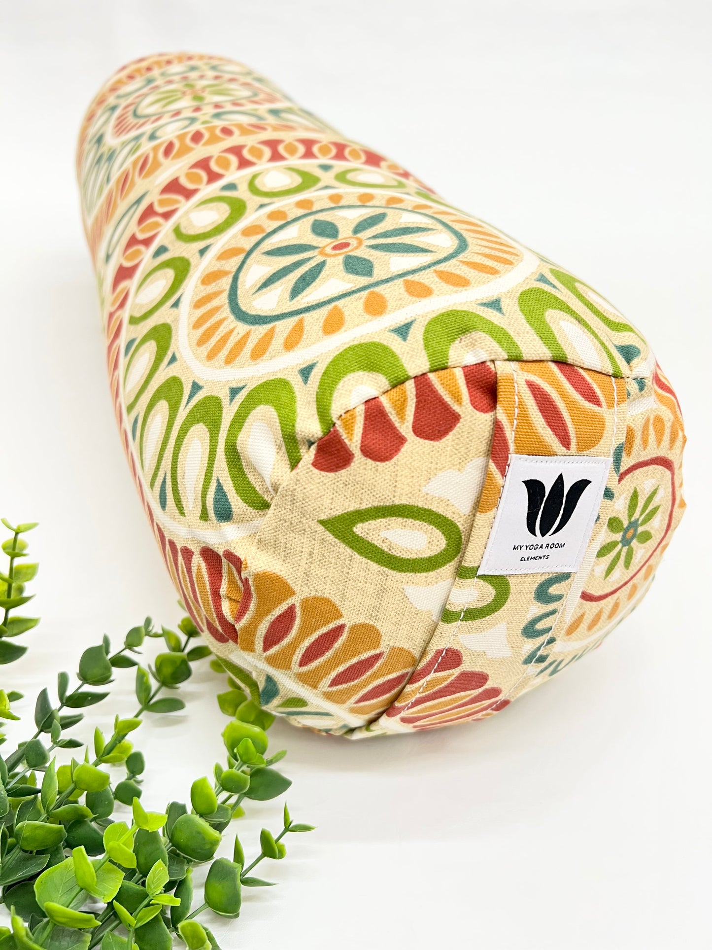 Round yoga bolster in cotton canvas citrus color mandala print fabric. Allergy conscious fill with removeable cover. Made in Canada by My Yoga Room Elements