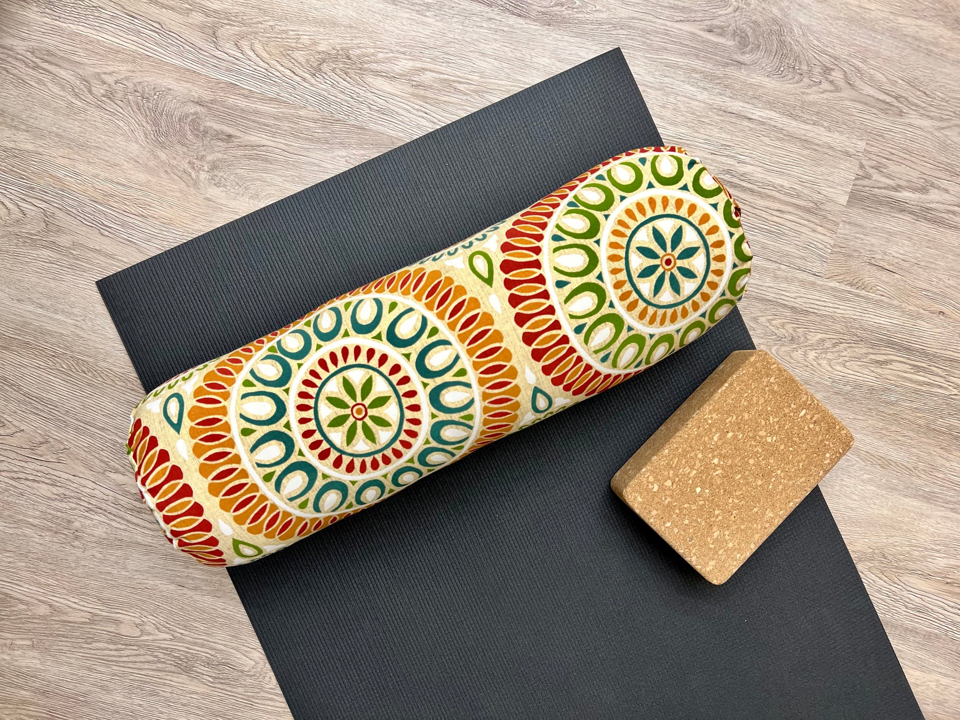 round yoga bolster in citrus color mandala print cotton fabric. made in calgary alberta canada