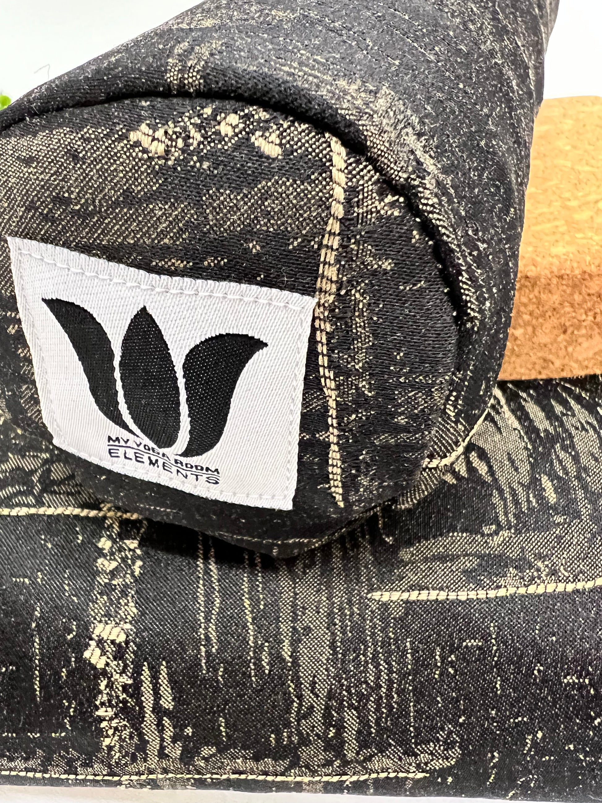 Mini yoga bolster in durable fabric, black and beige hatch print fabric. Cushion and support the body in the practice of yoga and meditation.Removeable cover. Made in Canada by My Yoga Room Elements
