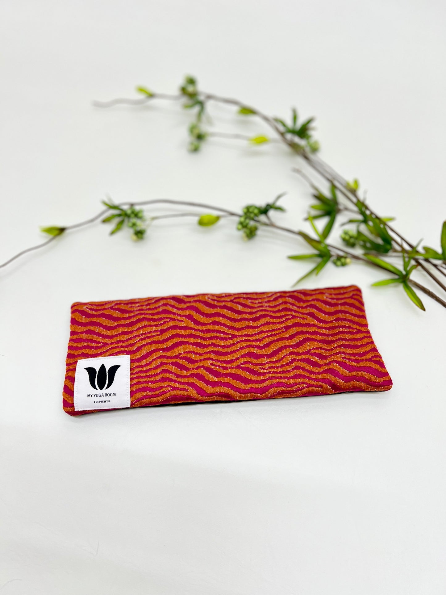 Yoga eye pillow, unscented, therapeutically weighted to soothe eye strain and stress or enhance your savasana. Handcrafted in Canada by My Yoga Room Elements. Orange/pink modern print and bamboo fabric.