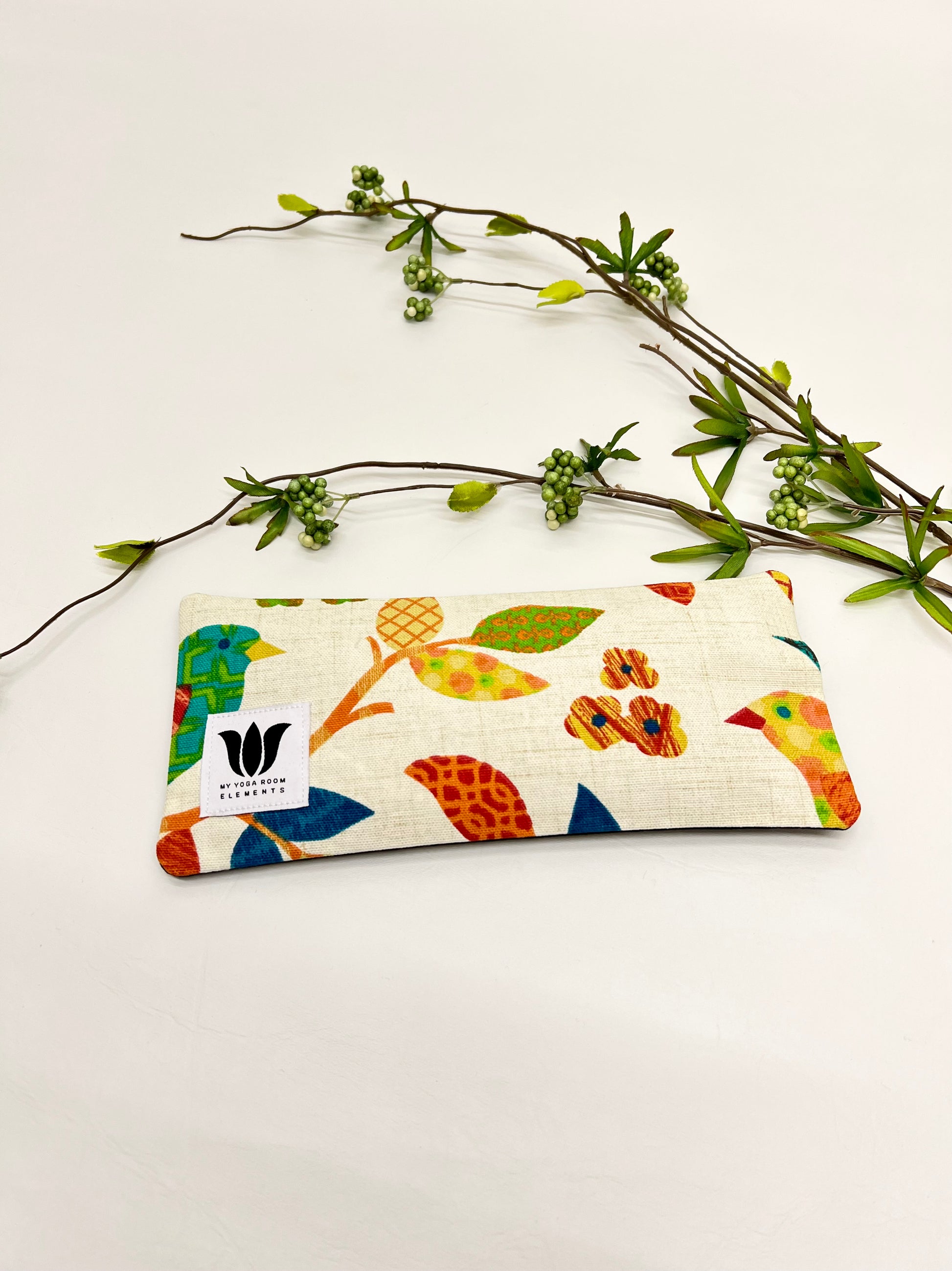 Yoga eye pillow, unscented, therapeutically weighted to soothe eye strain and stress or enhance your savasana. Handcrafted in Canada by My Yoga Room Elements. Rainbow natural print and bamboo fabric.