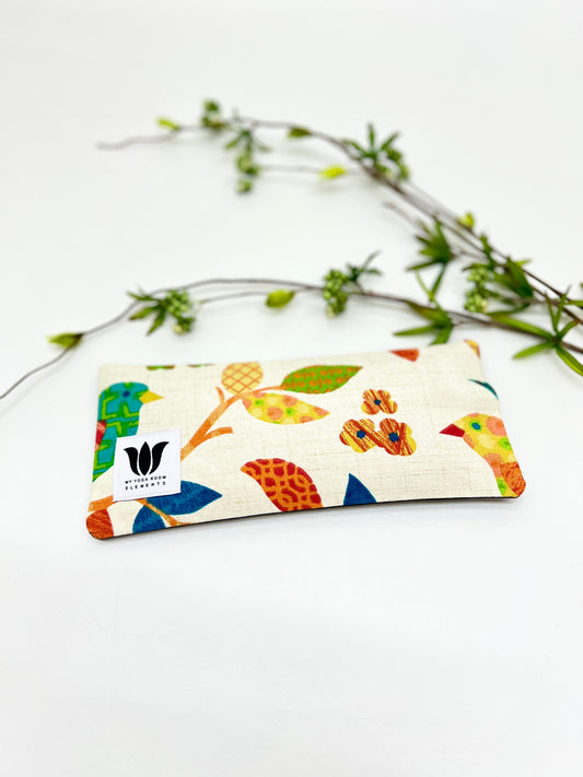 Yoga eye pillow, unscented, therapeutically weighted to soothe eye strain and stress or enhance your savasana. Handcrafted in Canada by My Yoga Room Elements. Rainbow natural print and bamboo fabric.