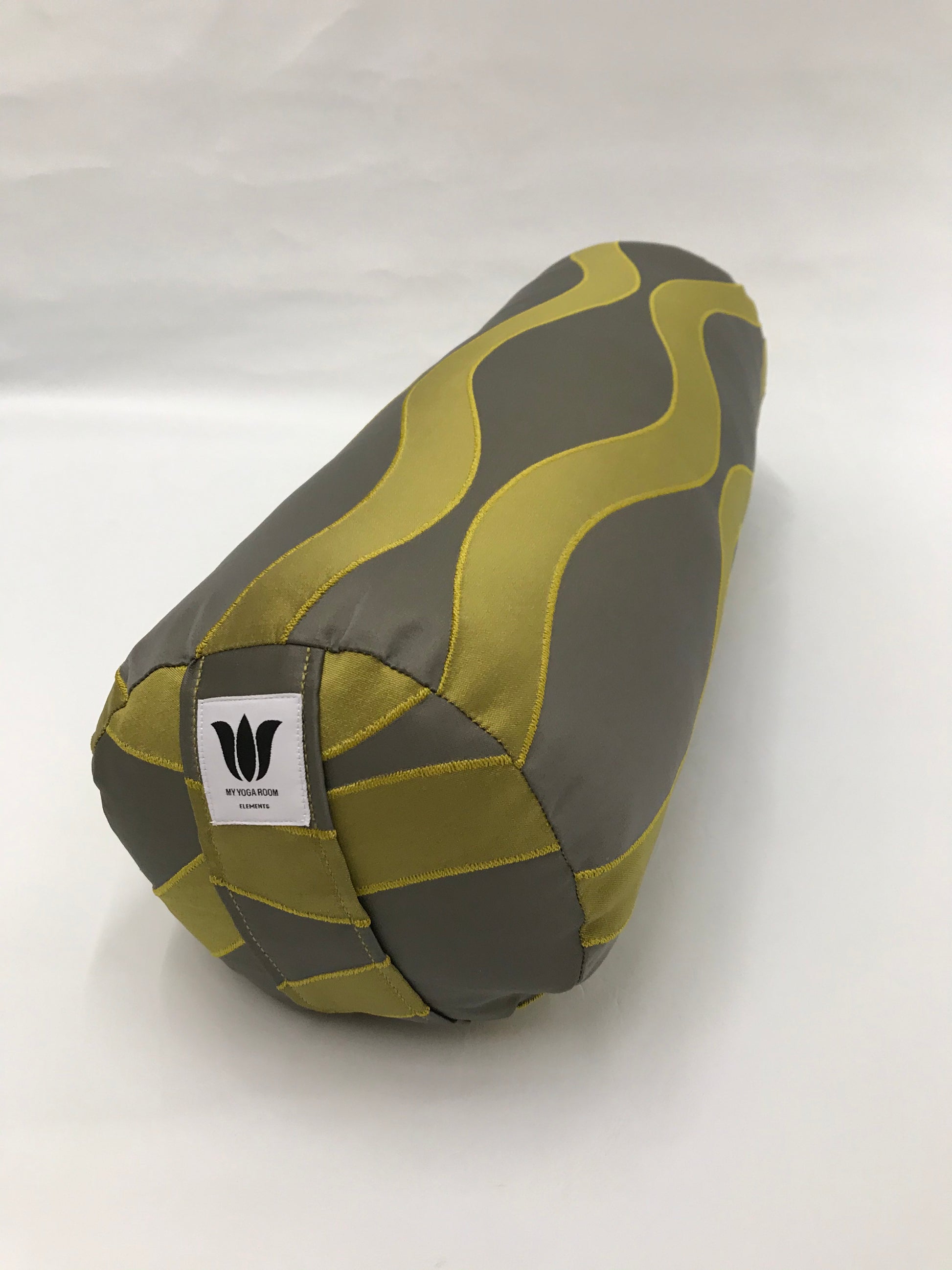 Round yoga bolster in modern graphic wave print, durable fabric, grey and green color fabric. Allergy conscious fill with removeable cover. Made in Canada by My Yoga Room Elements