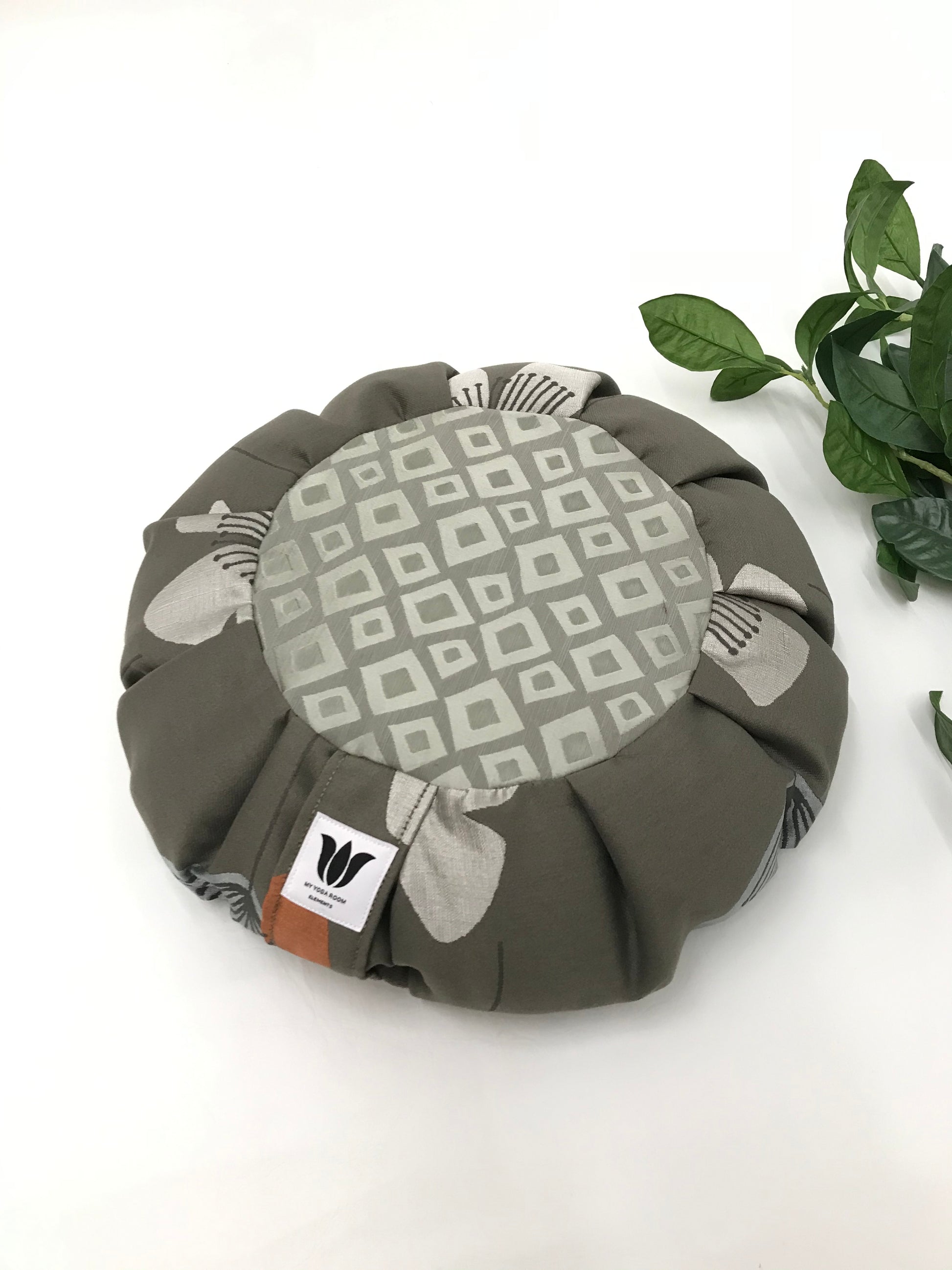 Handcrafted premium home decor fabric meditation seat cushion in rich sage gray green print fabric. Align the spine and body in comfort to calm the monkey mind in your meditation practice. Handcrafted in Calgary, Alberta Canada