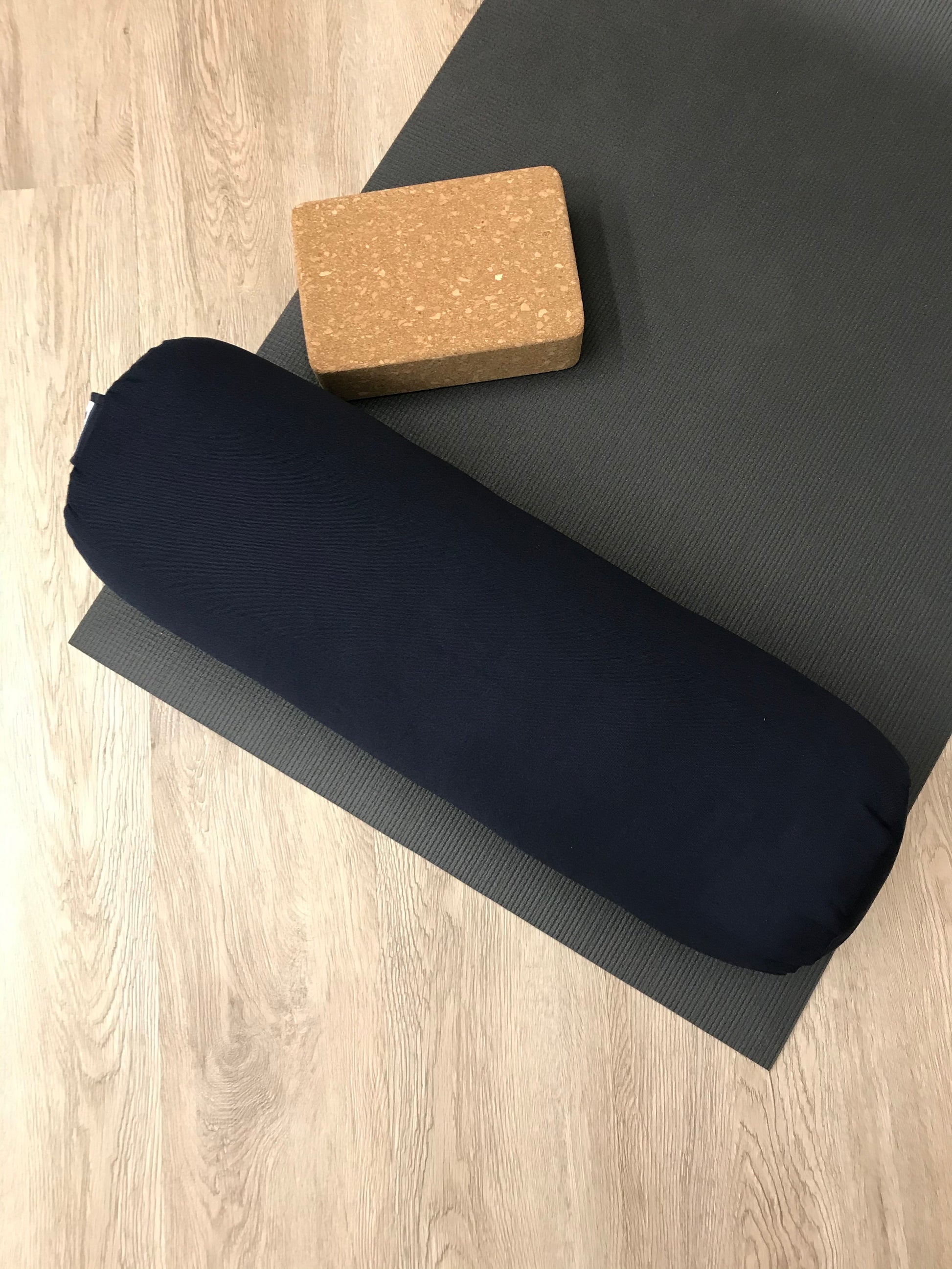 Round yoga bolster in durable cotton canvas, in solid navy blue fabric. Allergy conscious fill with removeable cover. Made in Canada by My Yoga Room Elements