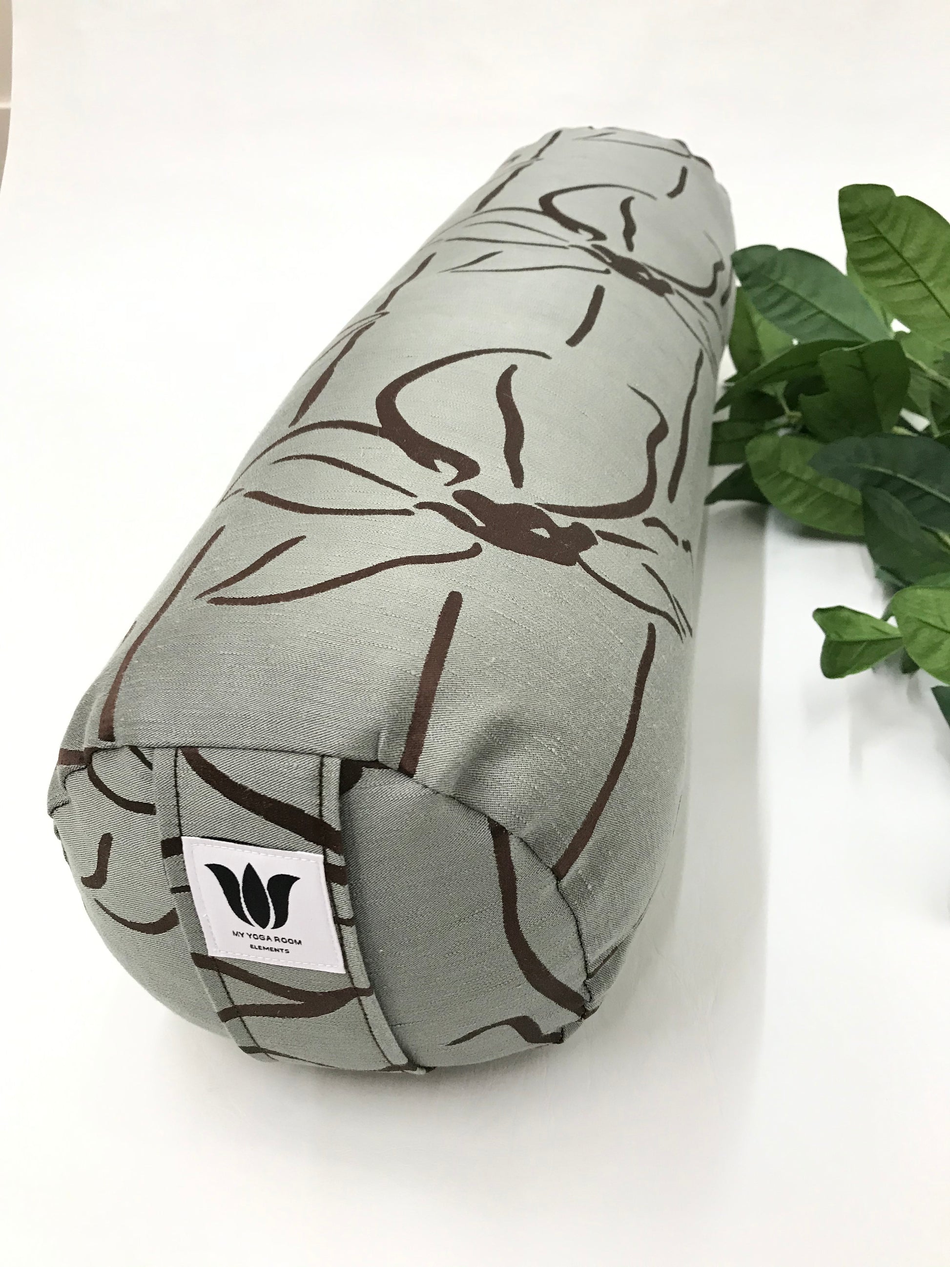 Round yoga bolster in textured linen fabric, line floral graphic in sage and brown fabric. Allergy conscious fill with removeable cover. Made in Canada by My Yoga Room Elements