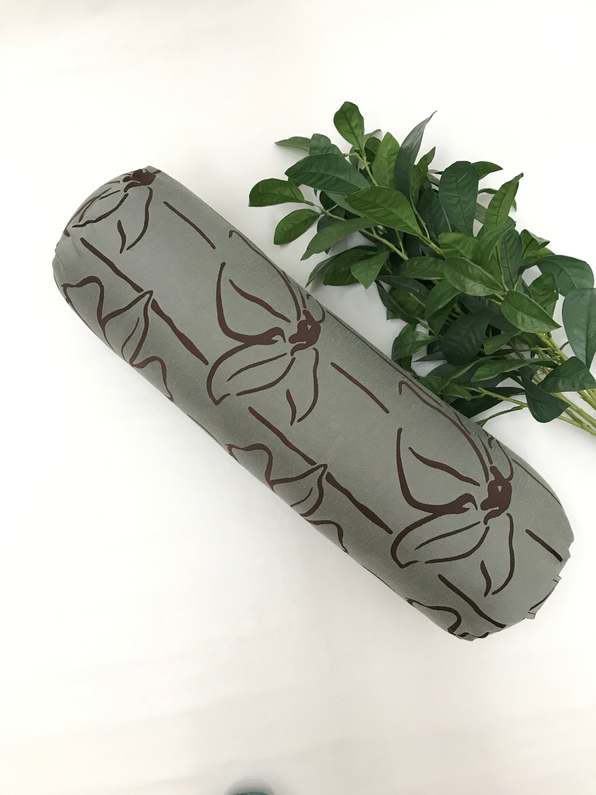 Round yoga bolster in textured linen fabric, line floral graphic in sage and brown fabric. Allergy conscious fill with removeable cover. Made in Canada by My Yoga Room Elements