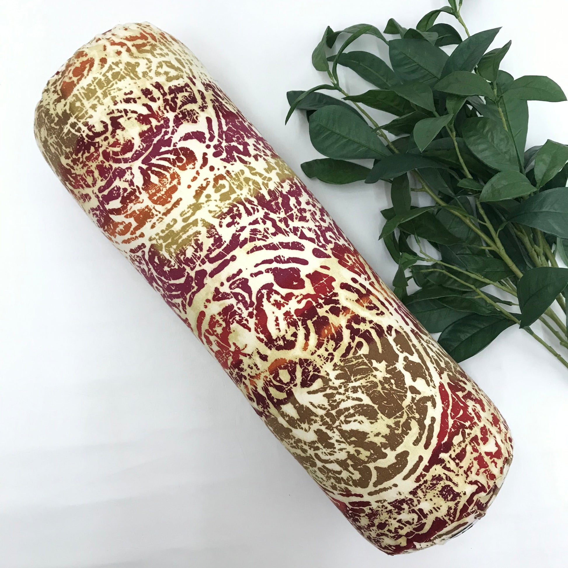 Round yoga bolster in durable cotton canvas, pink, yellow, orange, beige mottled print fabric. Allergy conscious fill with removeable cover. Made in Canada by My Yoga Room Elements