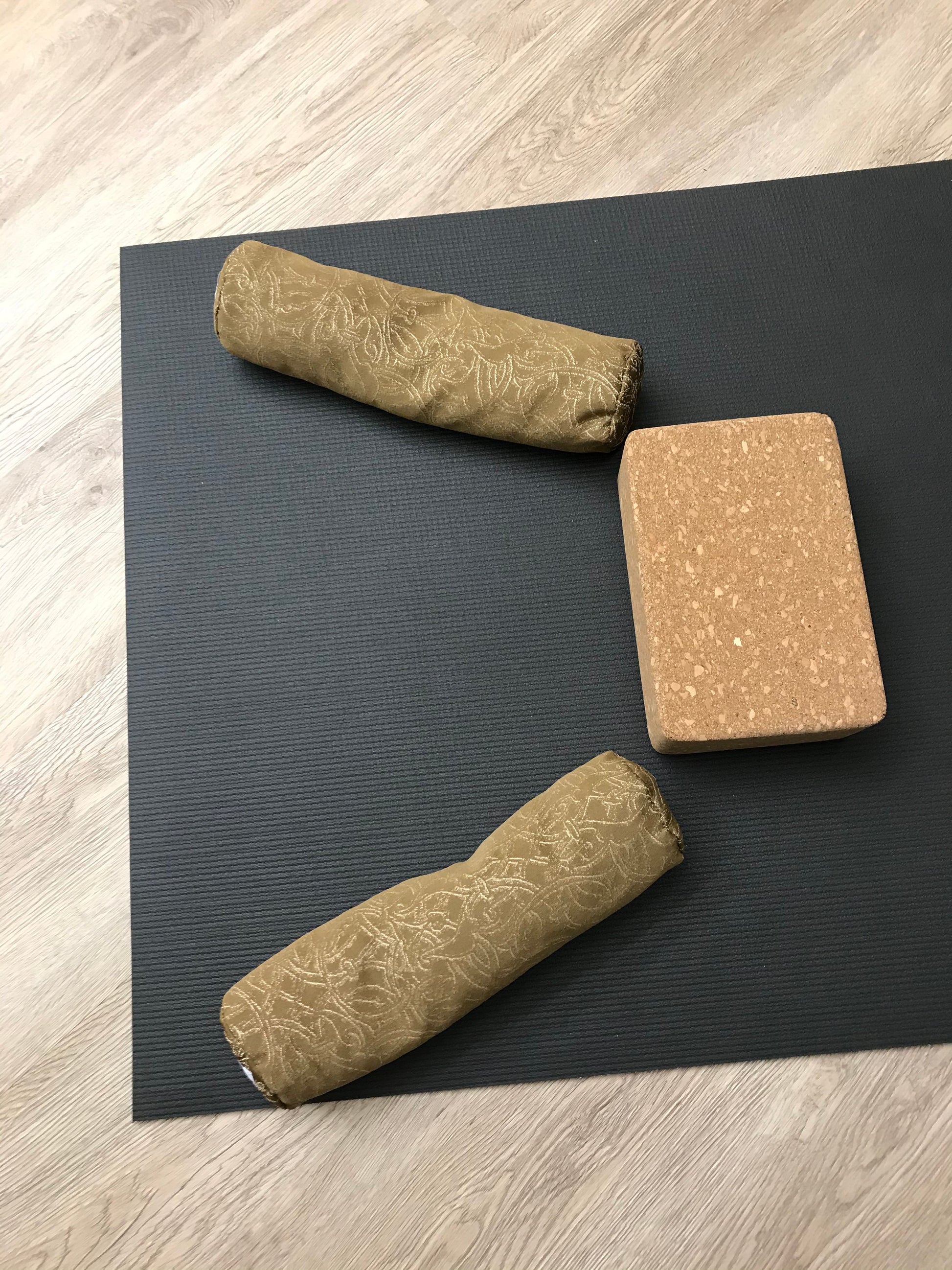 Mini yoga bolster in durable fabric, brown textured fabric. Cushion and support the body in the practice of yoga and meditation.Removeable cover. Made in Canada by My Yoga Room Elements