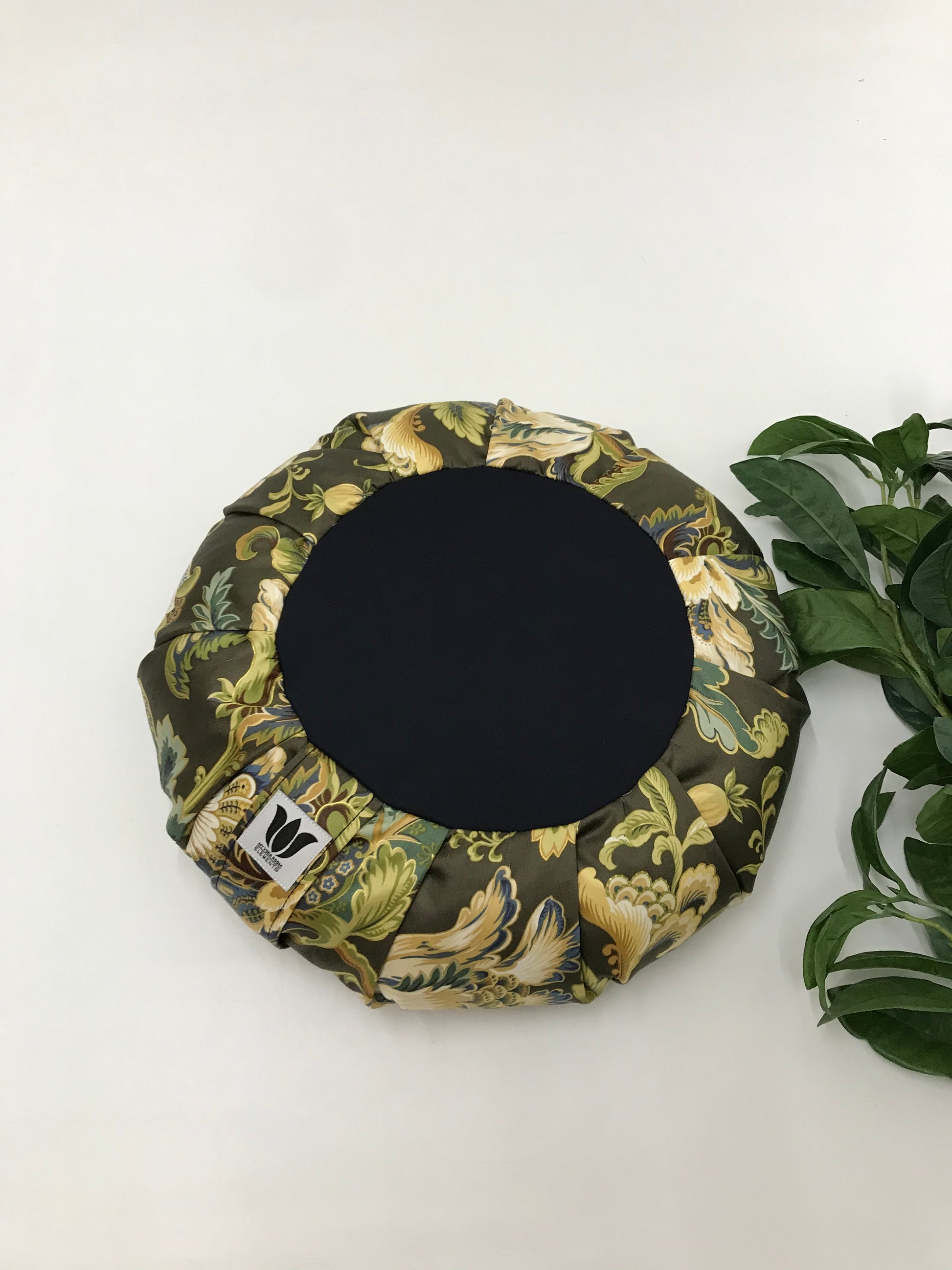 Handcrafted premium cotton sateen fabric meditation seat cushion in rich green and gold floral print fabric. Align the spine and body in comfort to calm the monkey mind in your meditation practice. Handcrafted in Calgary, Alberta Canada