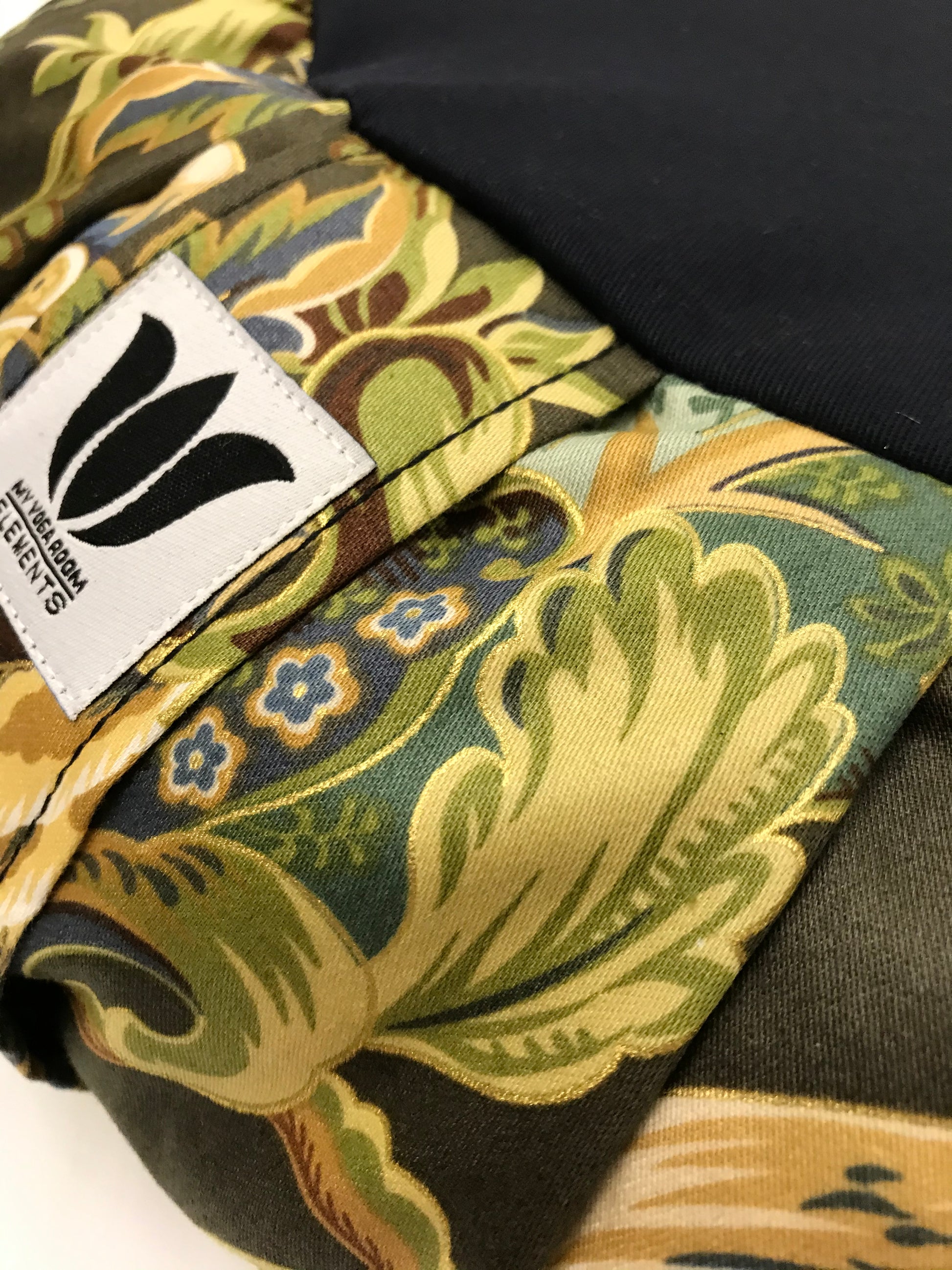 Handcrafted premium cotton sateen fabric meditation seat cushion in rich green and gold floral print fabric. Align the spine and body in comfort to calm the monkey mind in your meditation practice. Handcrafted in Calgary, Alberta Canada