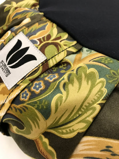 Handcrafted premium cotton sateen fabric meditation seat cushion in rich green and gold floral print fabric. Align the spine and body in comfort to calm the monkey mind in your meditation practice. Handcrafted in Calgary, Alberta Canada