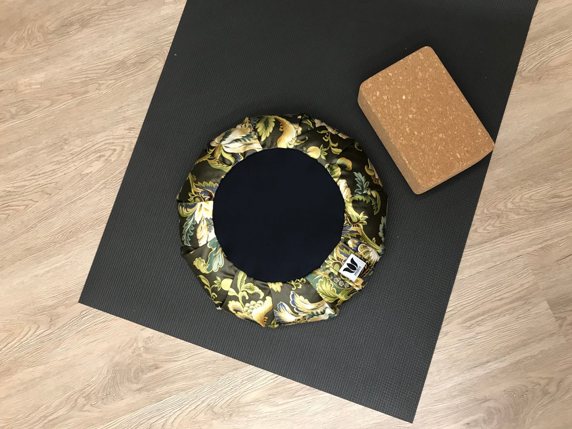Handcrafted premium cotton sateen fabric meditation seat cushion in rich green and gold floral print fabric. Align the spine and body in comfort to calm the monkey mind in your meditation practice. Handcrafted in Calgary, Alberta Canada