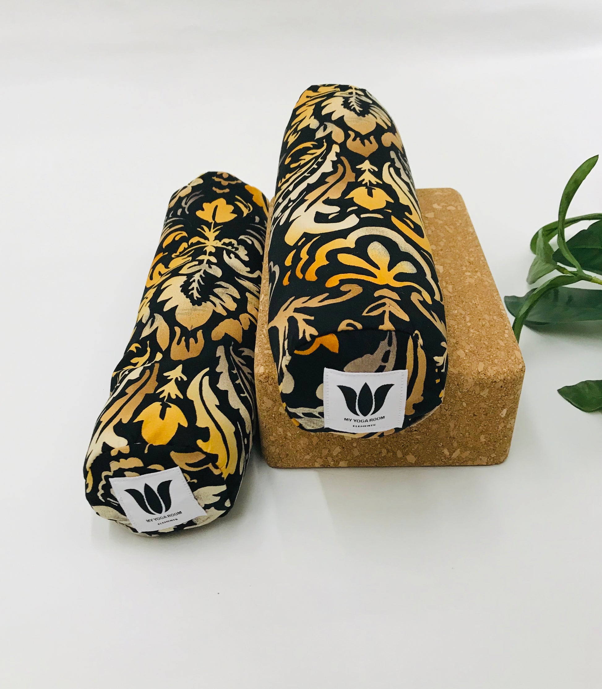 Mini yoga bolster in durable fabric, black and orange damask print fabric. Cushion and support the body in the practice of yoga and meditation.Removeable cover. Made in Canada by My Yoga Room Elements